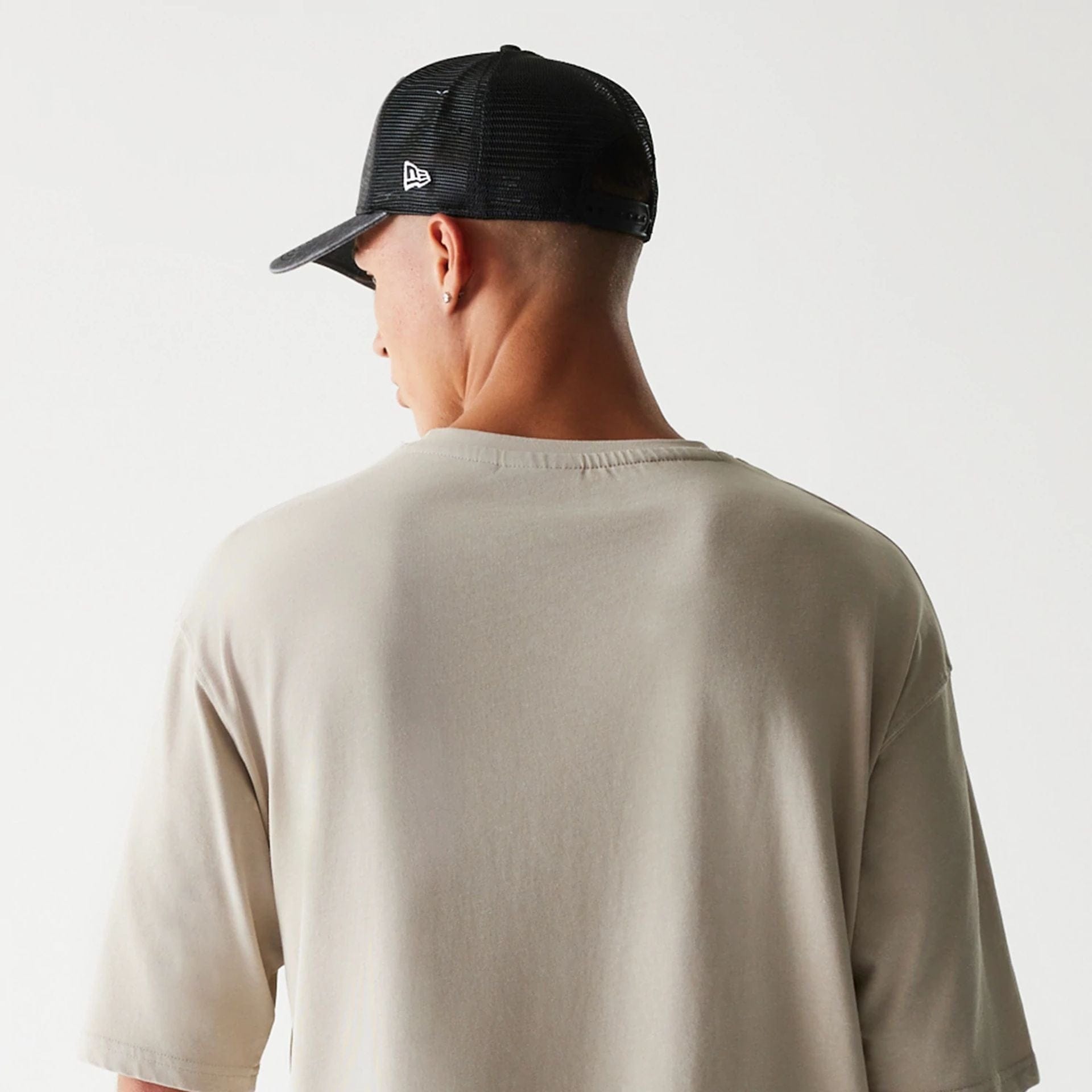 The Male model is wearing McLaren Racing Wordmark Light Beige Oversized T-Shirt 7