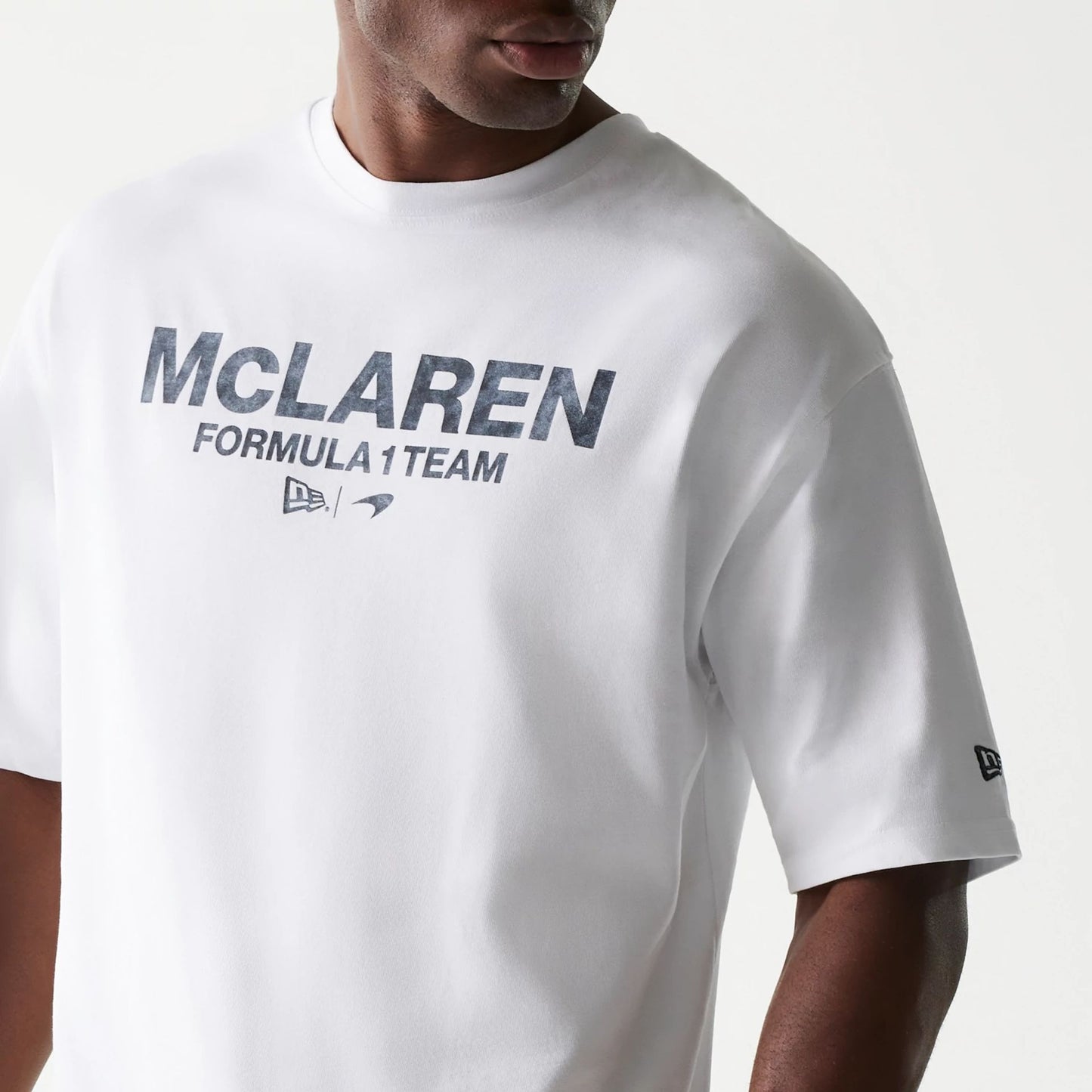 The Male model is wearing McLaren Racing Wordmark White Oversized T-Shirt 3