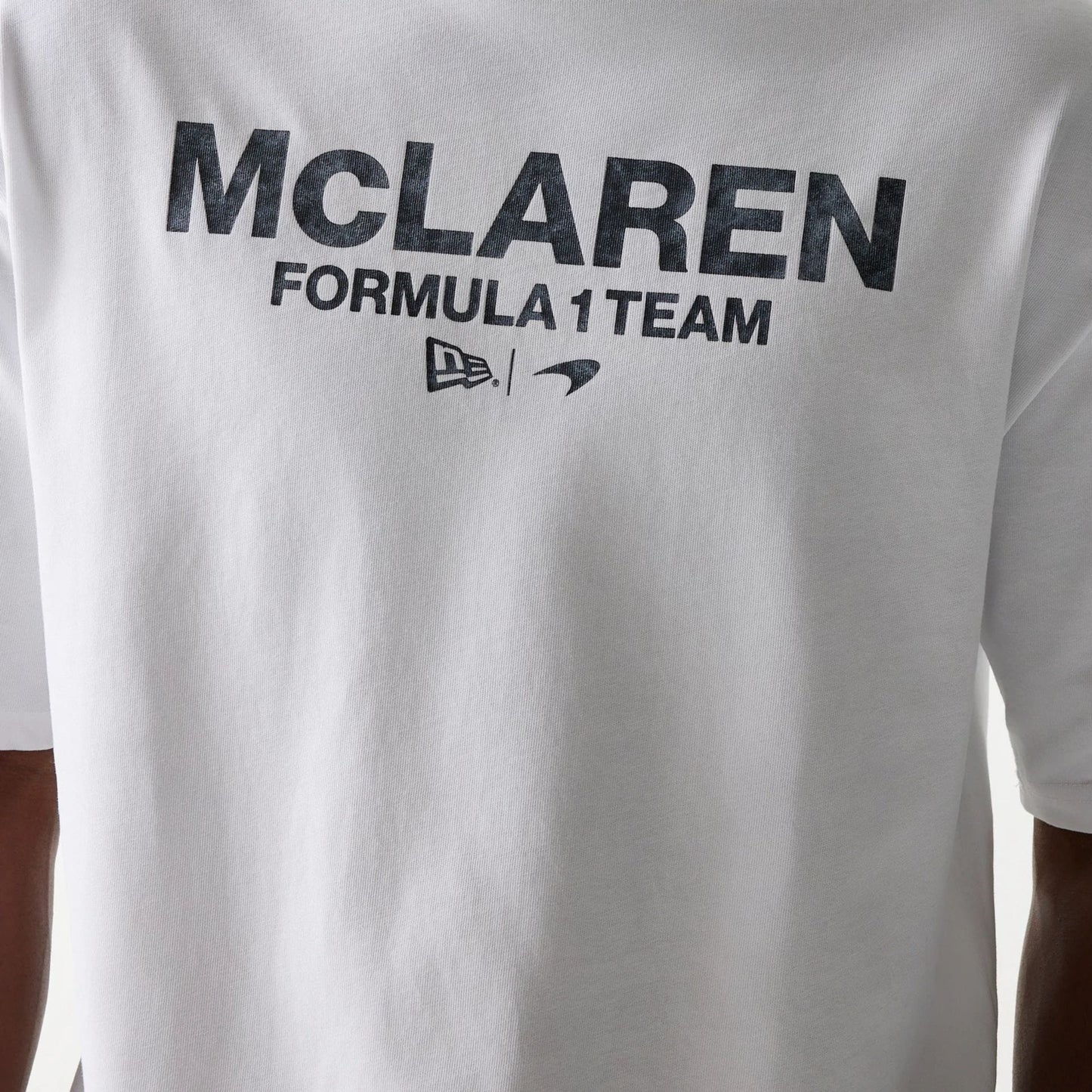 The Male model is wearing McLaren Racing Wordmark White Oversized T-Shirt 4