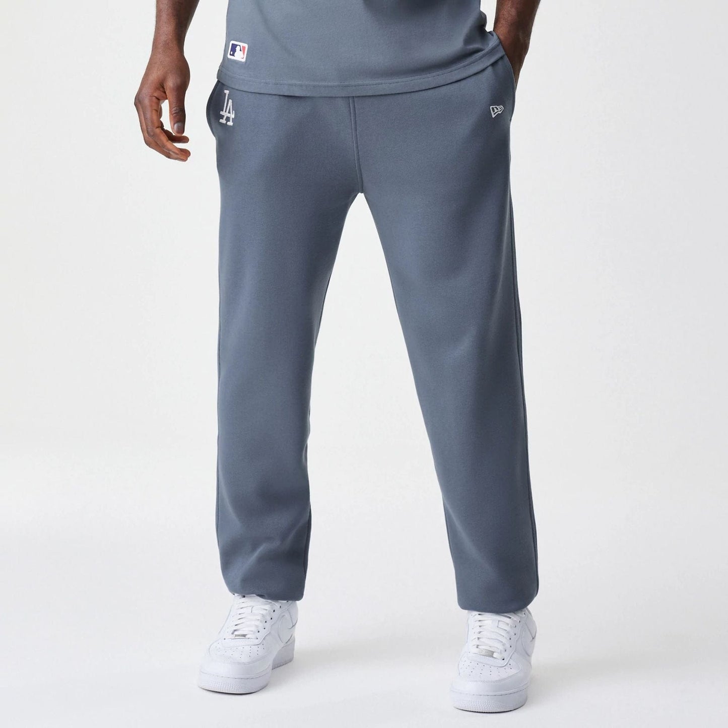 The Male model is wearing LA Dodgers MLB Midi League Essential Dark Grey Joggers  1