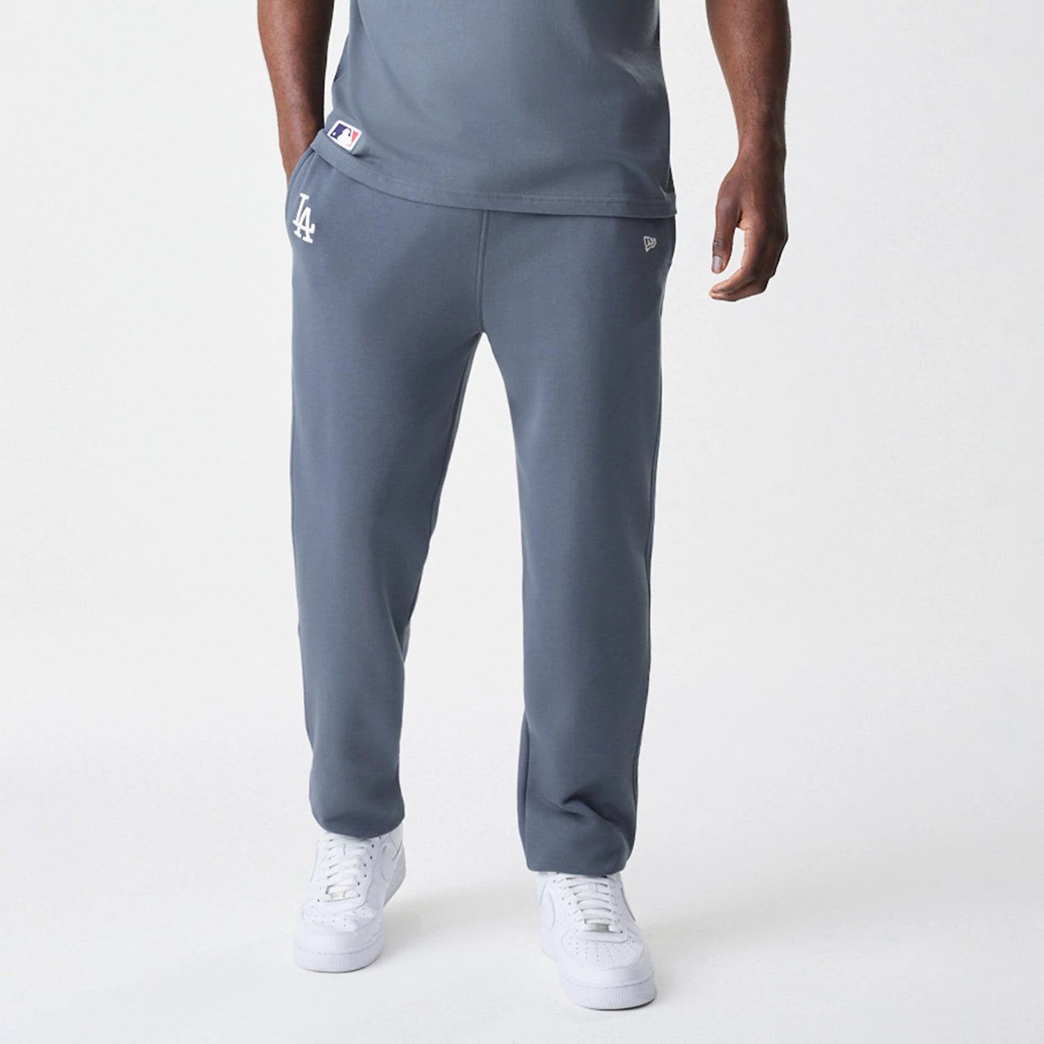 The Male model is wearing LA Dodgers MLB Midi League Essential Dark Grey Joggers 6