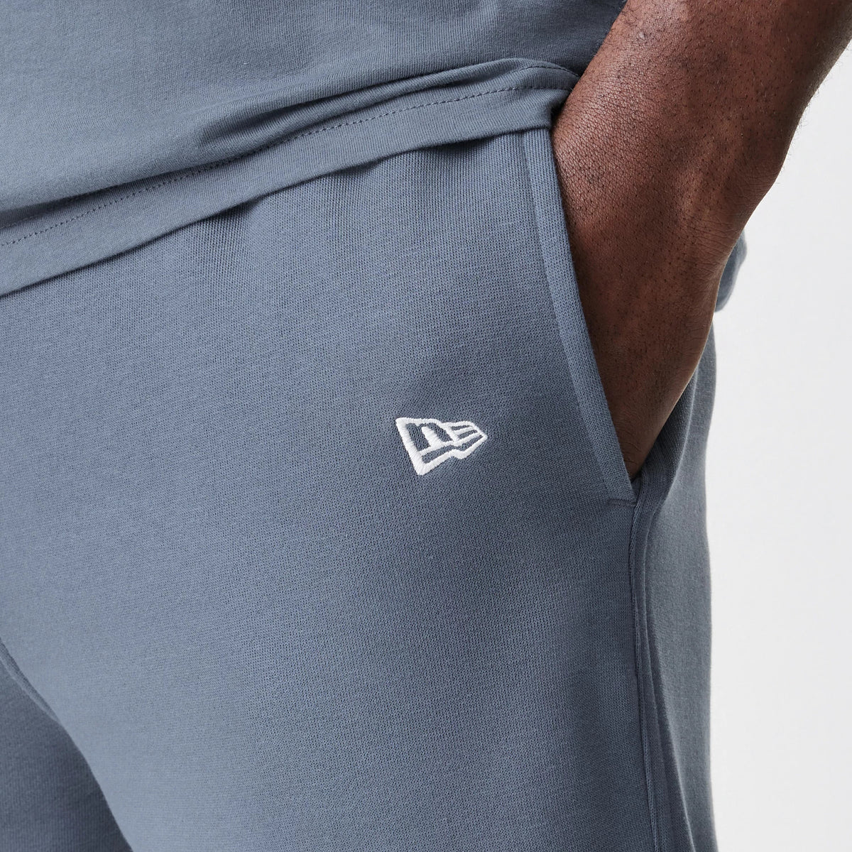 The Male model is wearing LA Dodgers MLB Midi League Essential Dark Grey Joggers 7