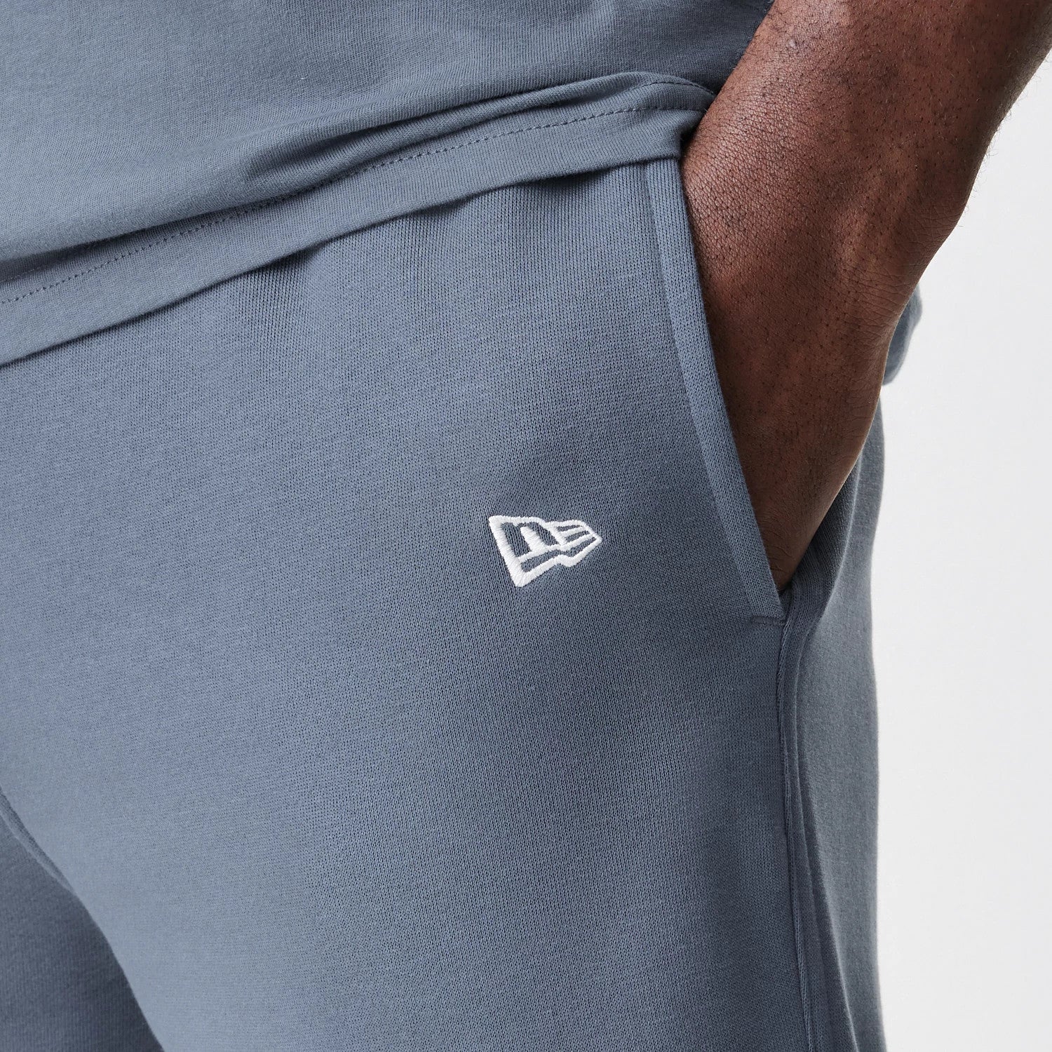 The Male model is wearing LA Dodgers MLB Midi League Essential Dark Grey Joggers 7