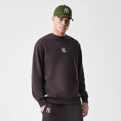 The Male model is wearing New York Yankees MLB Midi League Essential Dark Brown Oversized Crew Neck Sweater 3