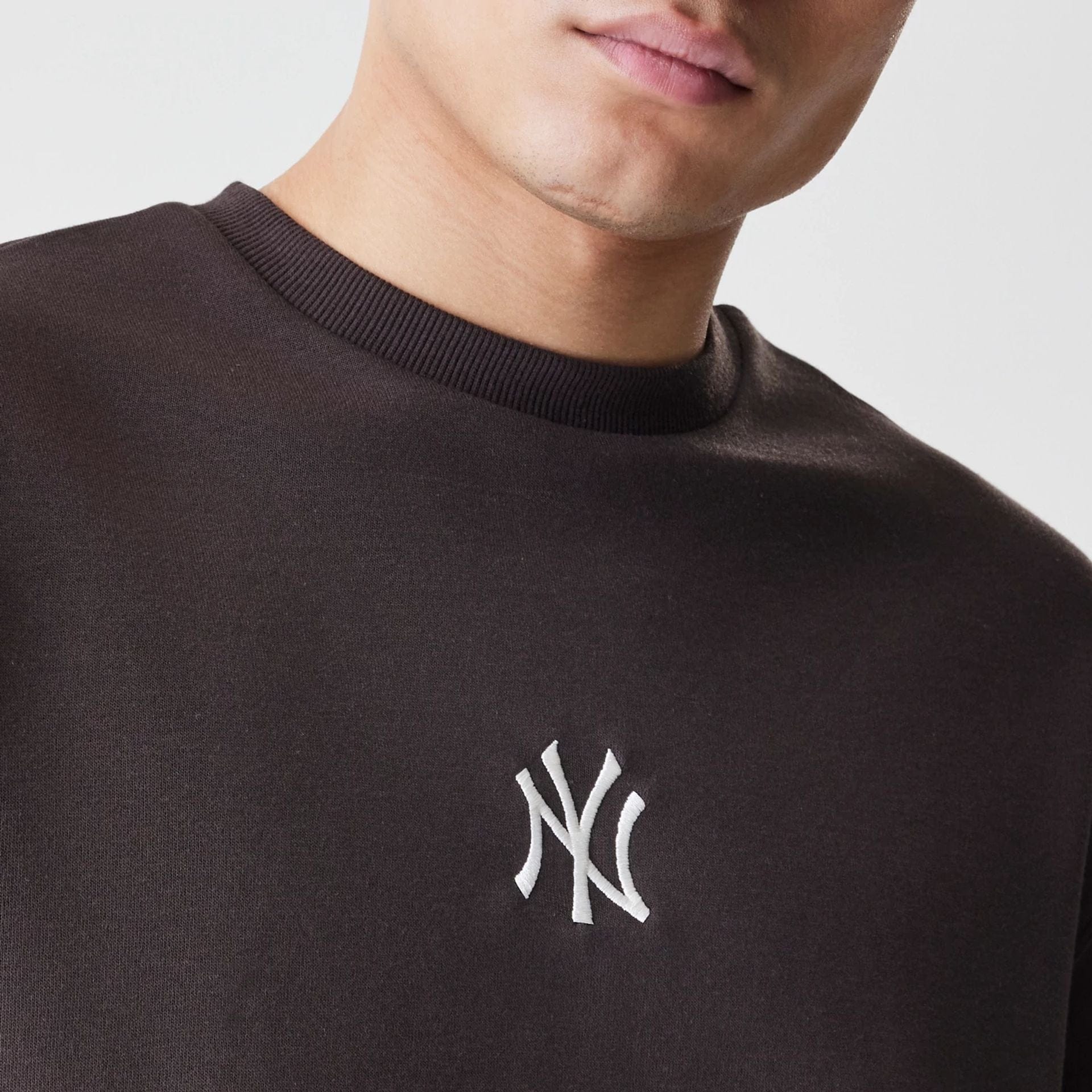 The Male model is wearing New York Yankees MLB Midi League Essential Dark Brown Oversized Crew Neck Sweater  4