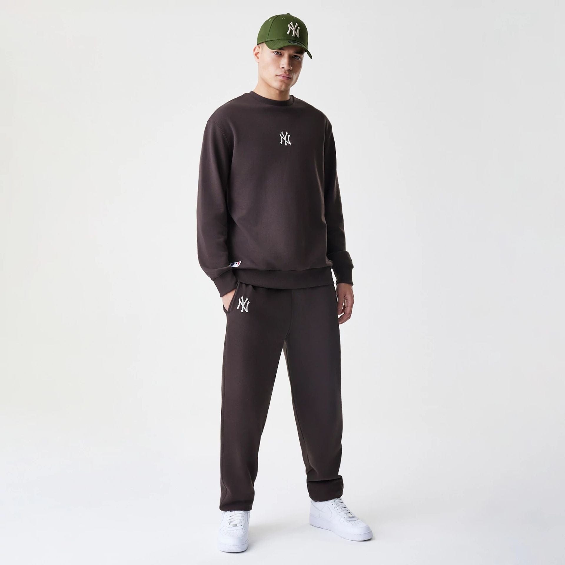 The Male model is wearing New York Yankees MLB Midi League Essential Dark Brown Oversized Crew Neck Sweater  8