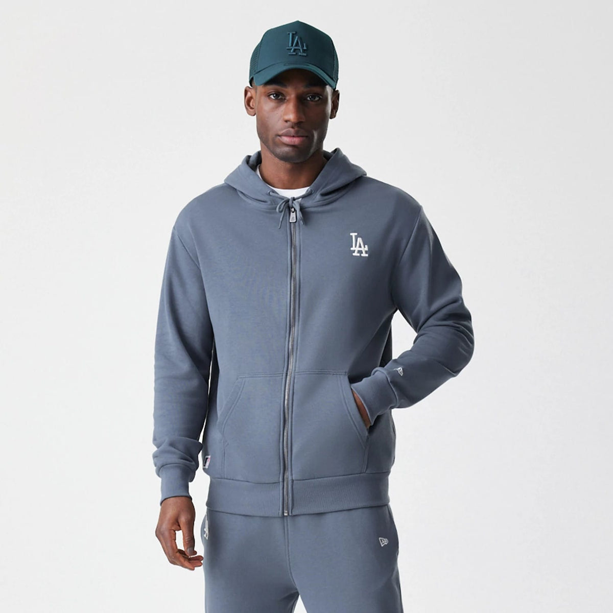 The Male model is wearing LA Dodgers MLB Midi League Essential Dark Grey Full Zip Hoodie 7