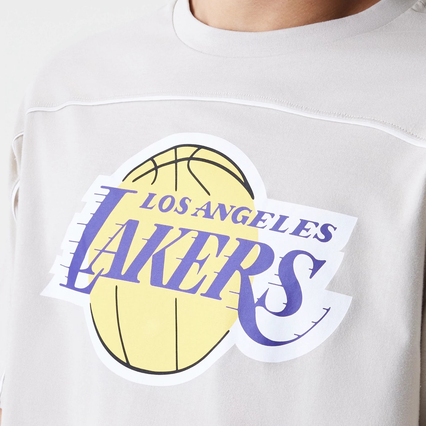 The Male model is wearing LA Lakers NBA Piping Light Beige Oversized T-Shirt 3