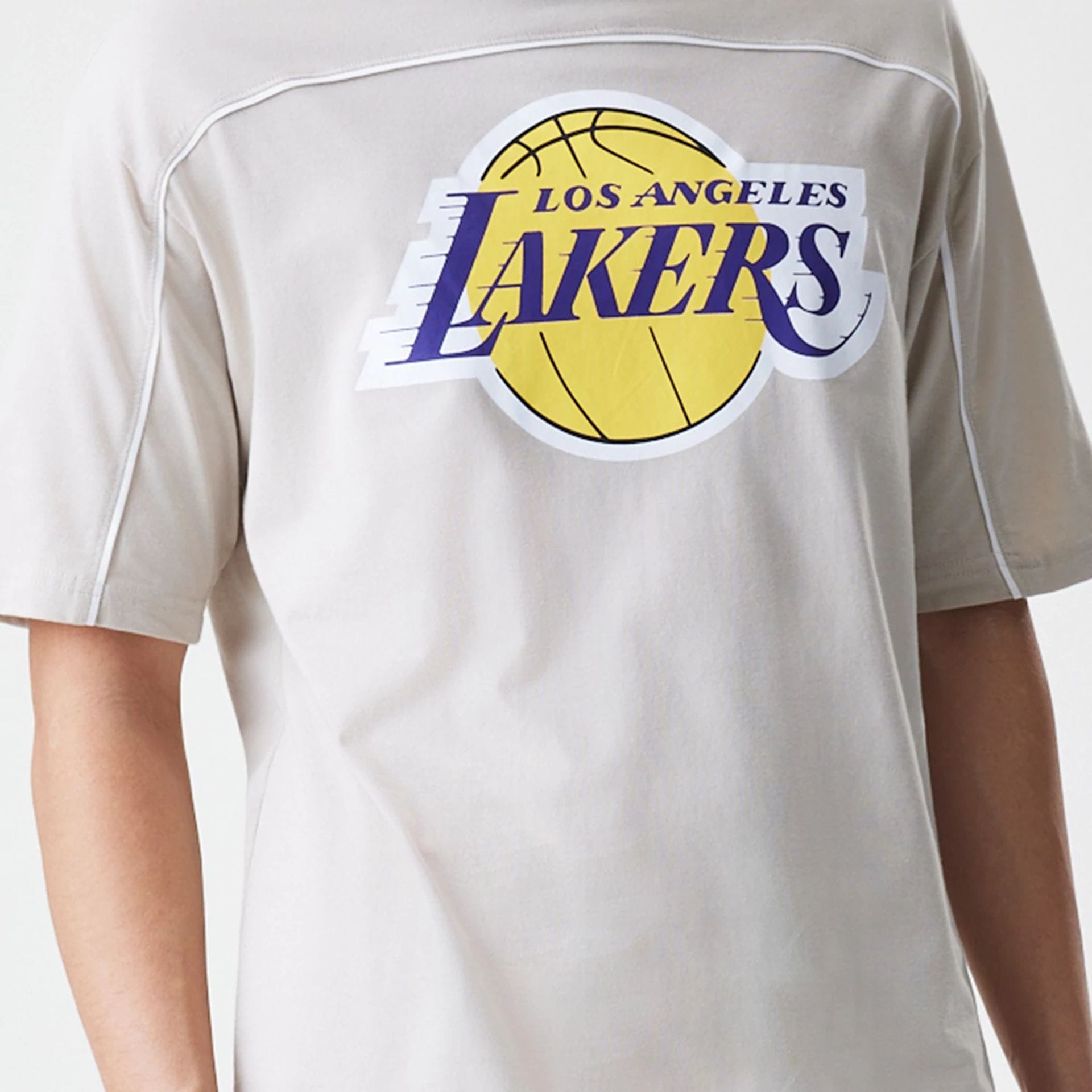 The Male model is wearing LA Lakers NBA Piping Light Beige Oversized T-Shirt  6