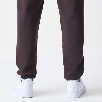 The Male model is wearing New York Yankees MLB Midi League Essential Dark Brown Joggers 4