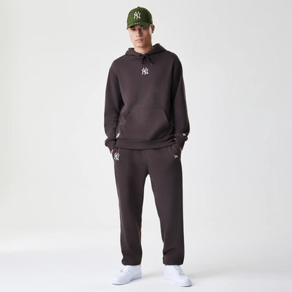 The Male model is wearing New York Yankees MLB Midi League Essential Dark Brown Joggers  8