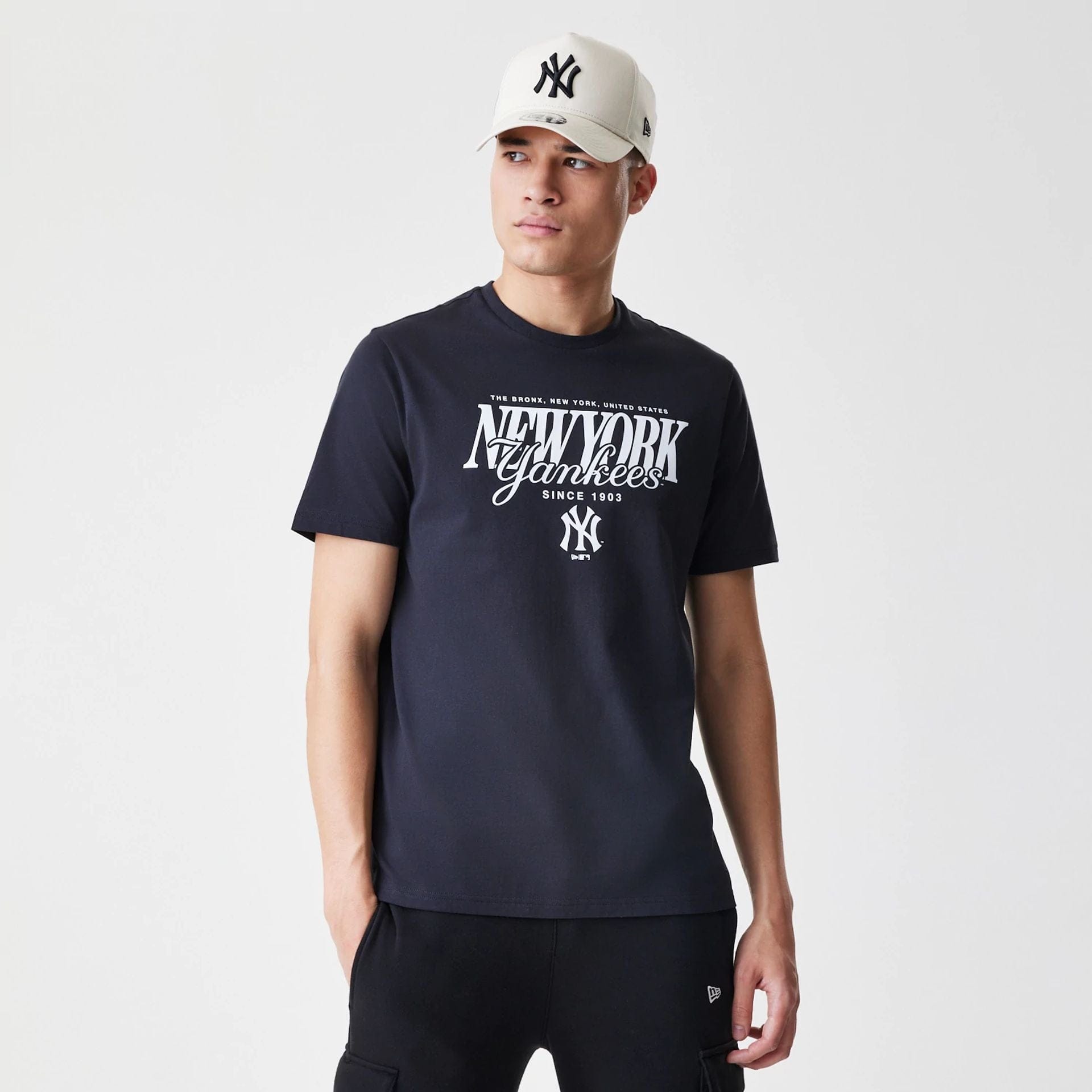 The Male model is wearing New York Yankees MLB Script Graphic Navy T-Shirt  1