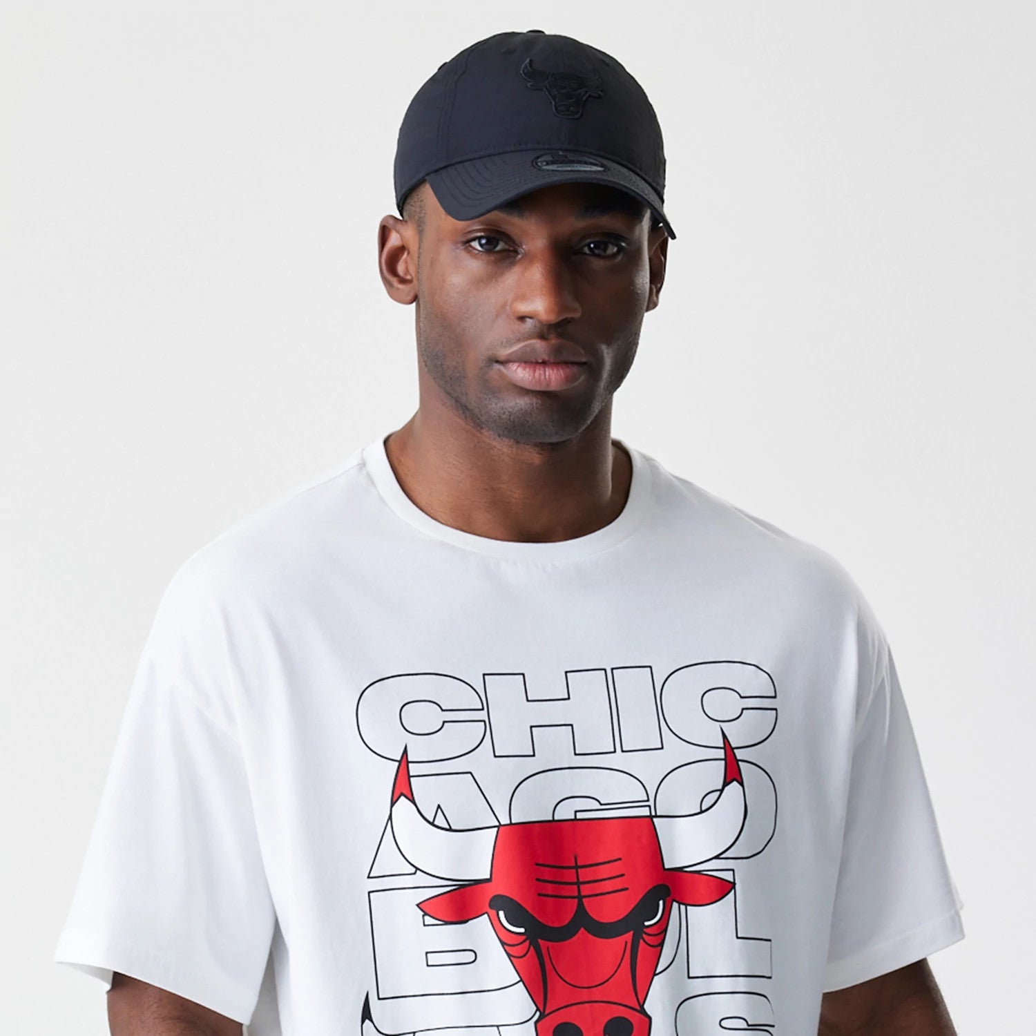 The Male model is wearing Chicago Bulls NBA Outline Graphic White Oversized T-Shirt 6