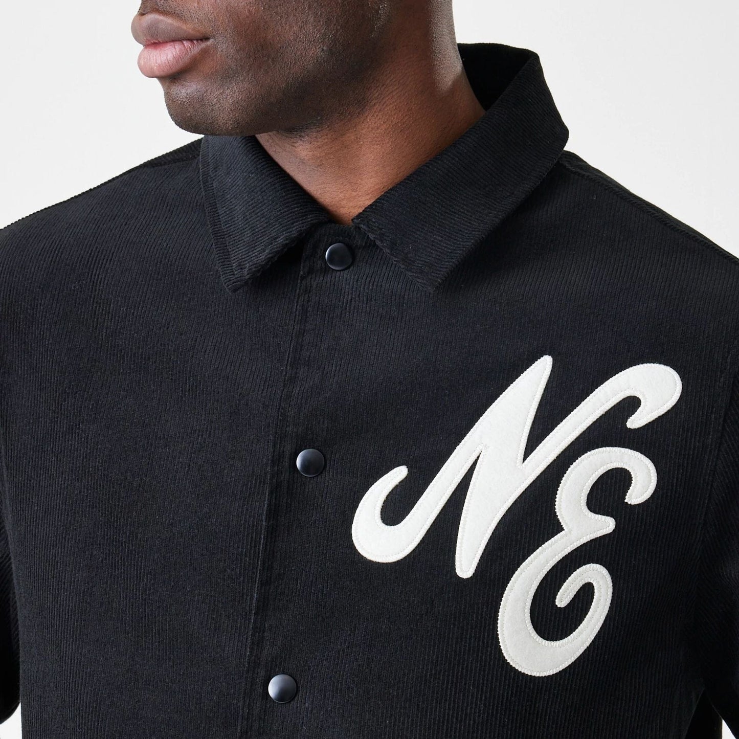 The Male model is wearing  New Era Cord Black Coaches Jacket  6