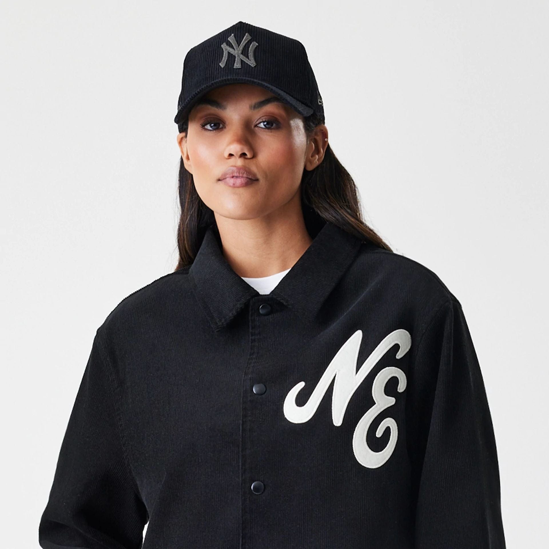 The Male model is wearing  New Era Cord Black Coaches Jacket  5