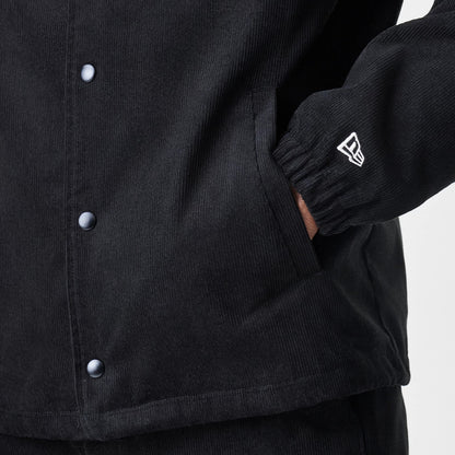 The Male model is wearing  New Era Cord Black Coaches Jacket 7