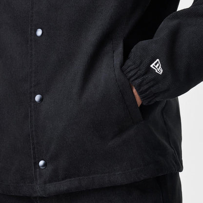 The Male model is wearing  New Era Cord Black Coaches Jacket 7