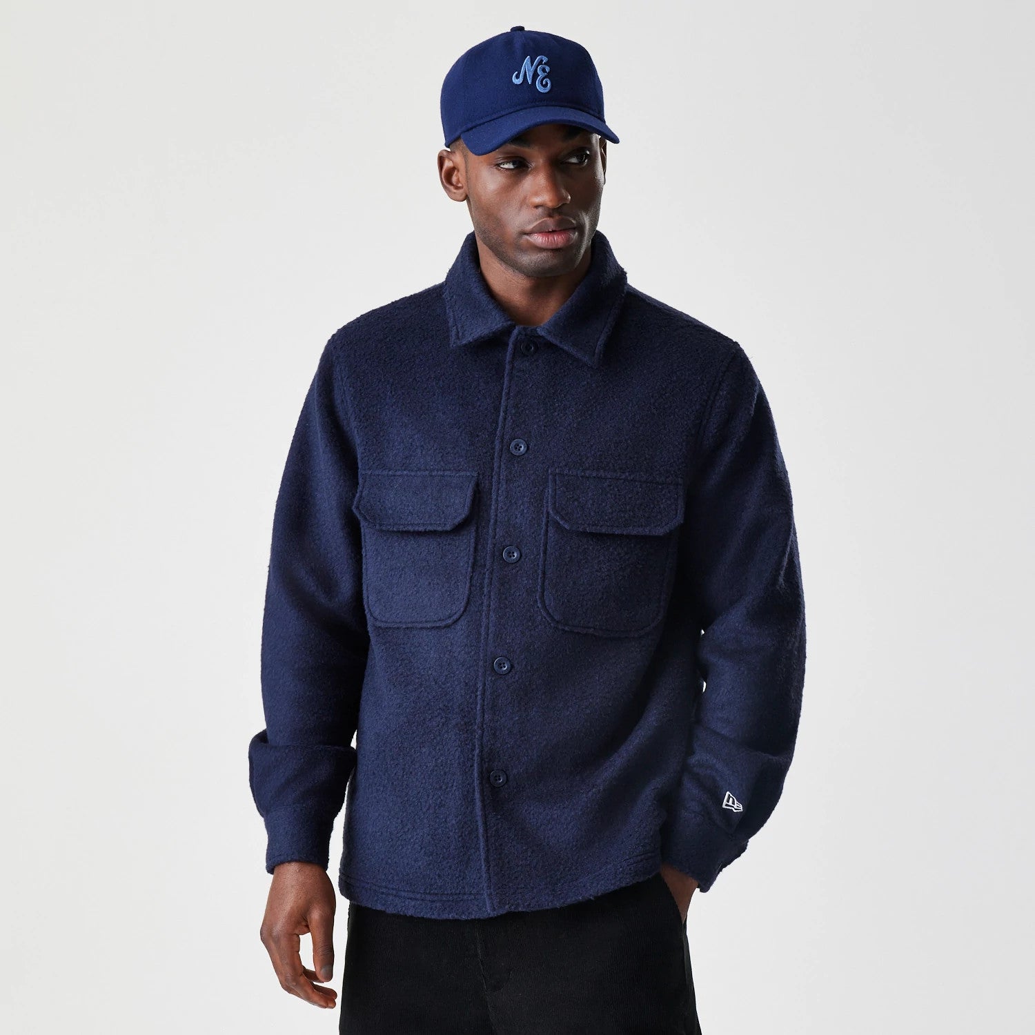 The Male model is wearing  New Era Borg Navy Shacket 1