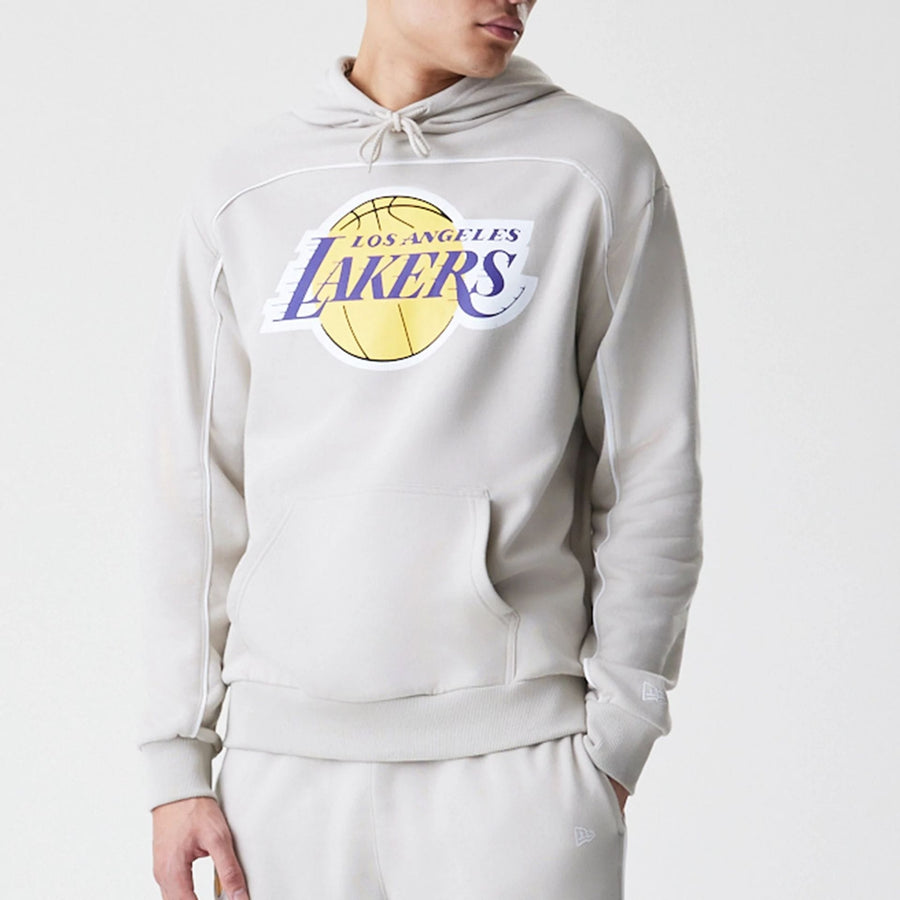 The Male model is wearing LA Lakers NBA Piping Cream Oversized Pullover Hoodie  3