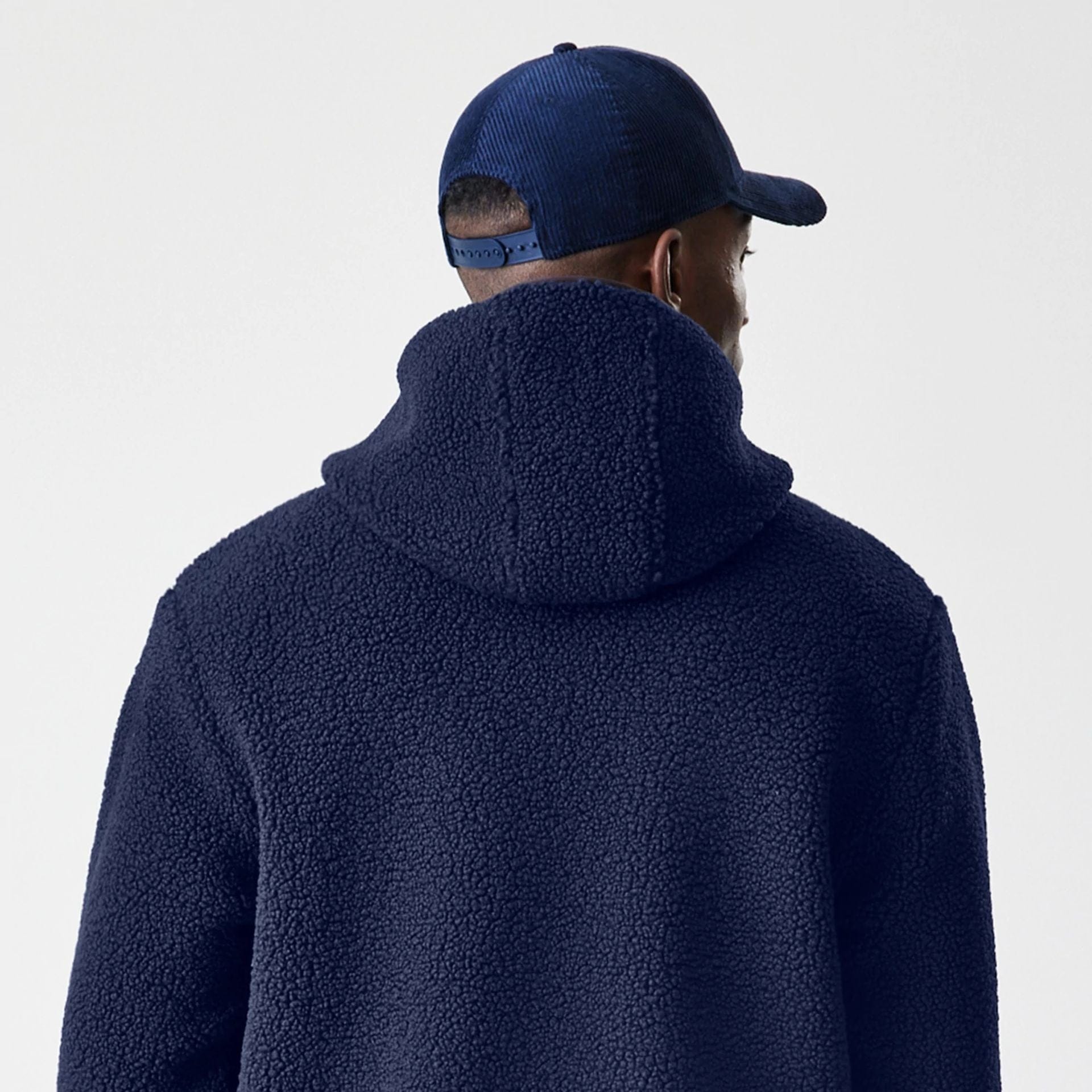 The Male model is wearing  New Era Navy Hooded Sherpa Jacket  8