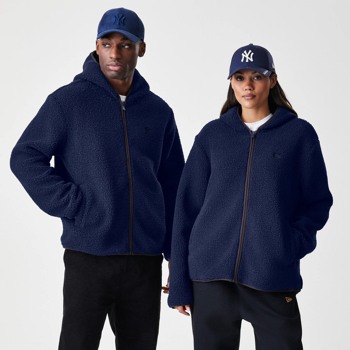 The Male model is wearing  New Era Navy Hooded Sherpa Jacket 1