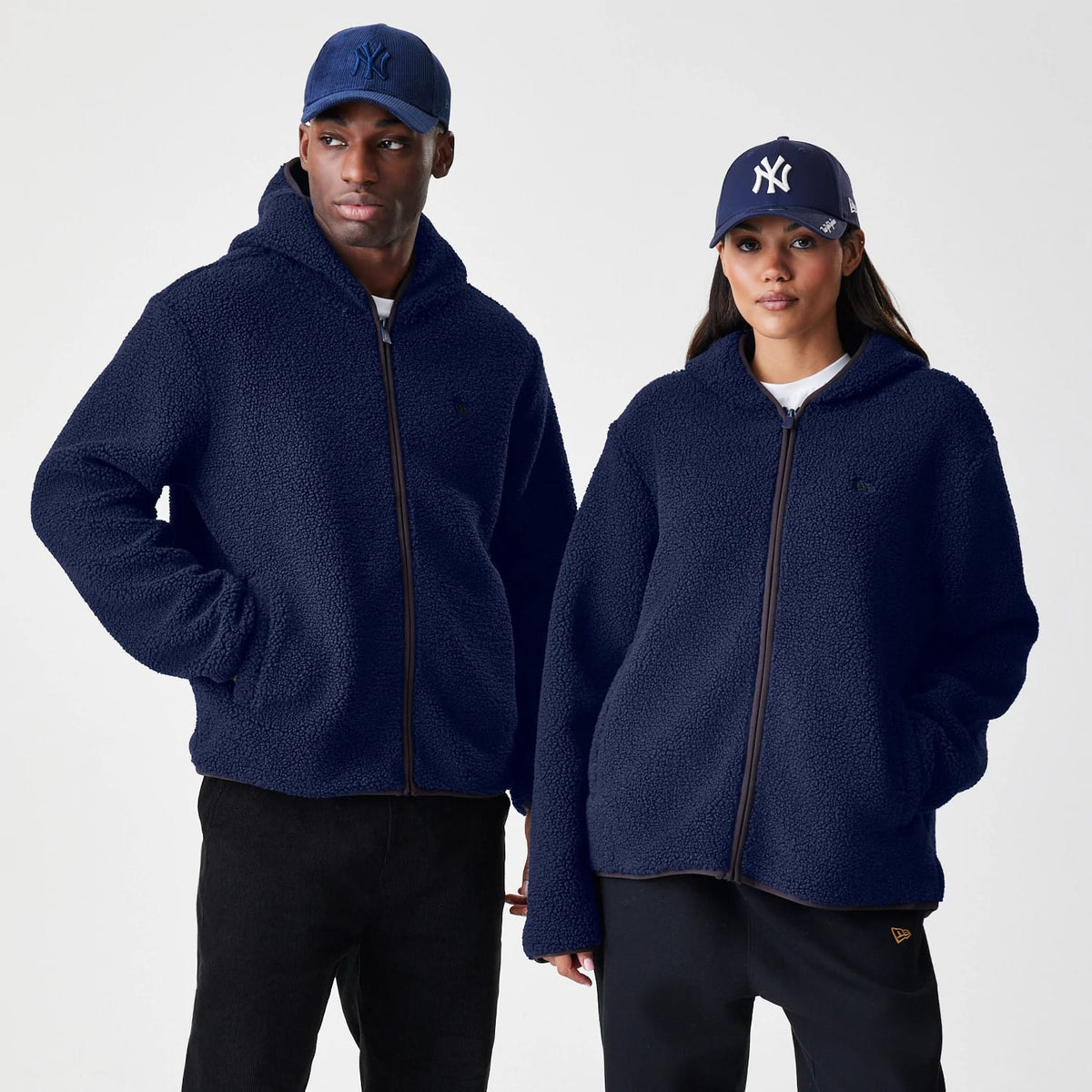 The Male model is wearing  New Era Navy Hooded Sherpa Jacket 1