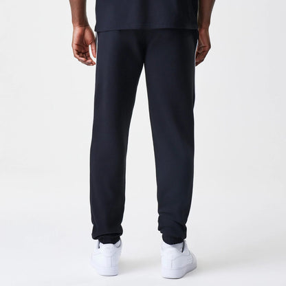The Male model is wearing Chicago Bulls NBA Piping Navy Joggers 2
