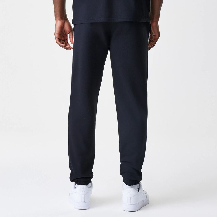 The Male model is wearing Chicago Bulls NBA Piping Navy Joggers  2
