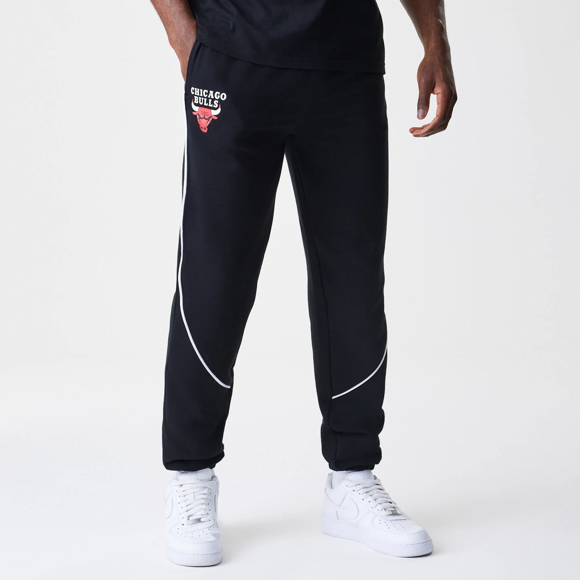 The Male model is wearing Chicago Bulls NBA Piping Navy Joggers  1