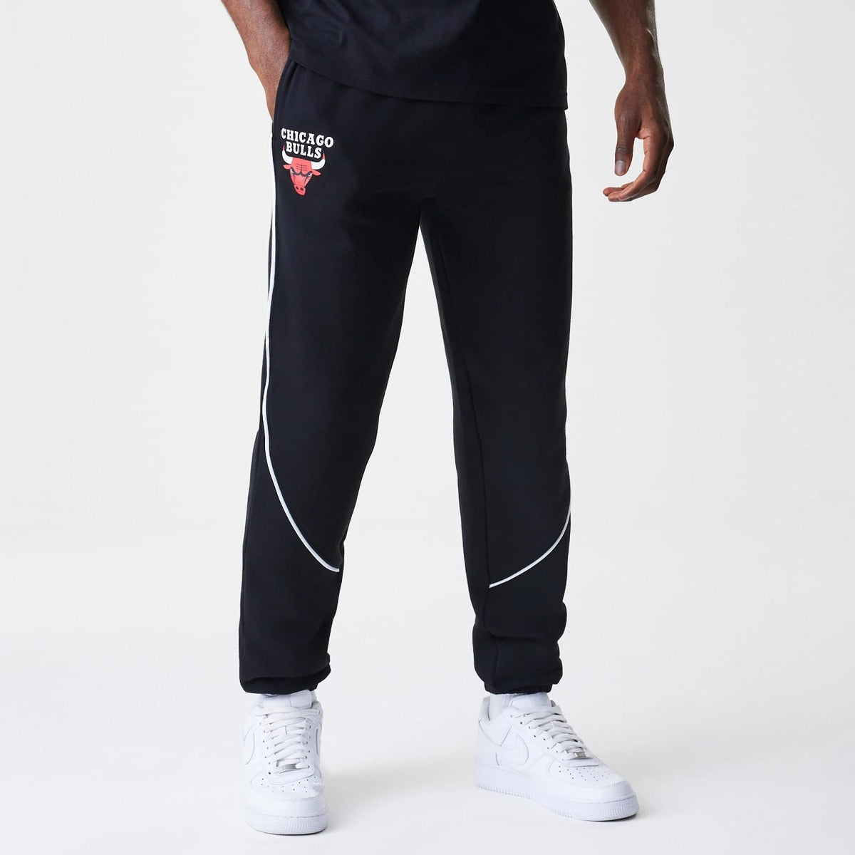 The Male model is wearing Chicago Bulls NBA Piping Navy Joggers 1