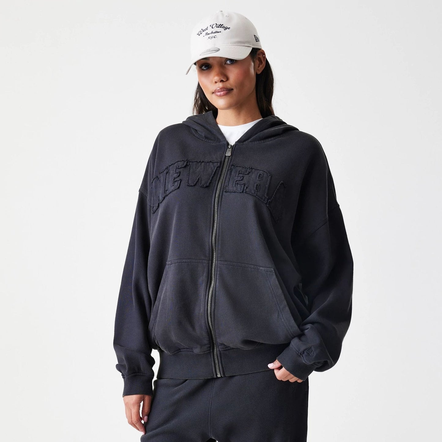 The Male model is wearing  New Era Washed Black Oversized Full Zip Hoodie 4