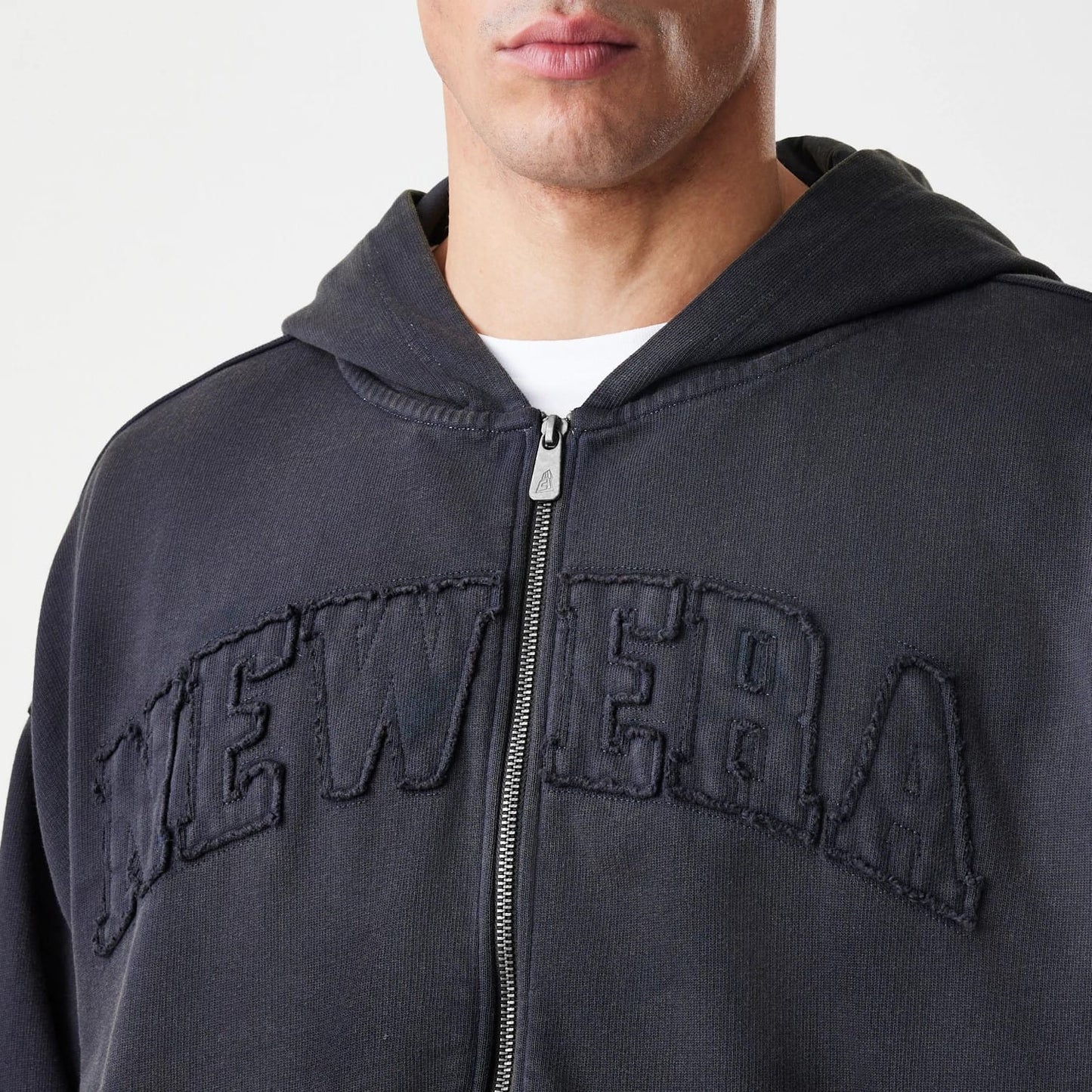 The Male model is wearing  New Era Washed Black Oversized Full Zip Hoodie 5