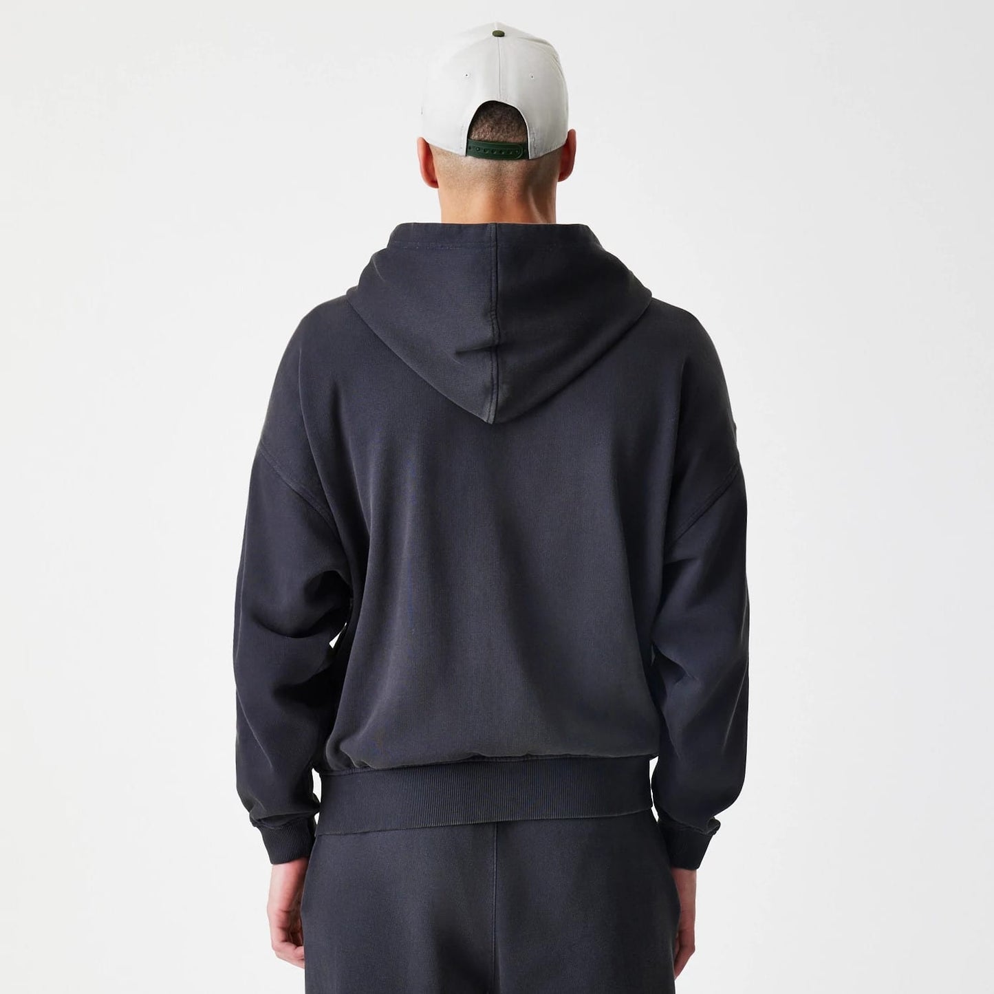 The Male model is wearing  New Era Washed Black Oversized Full Zip Hoodie 2