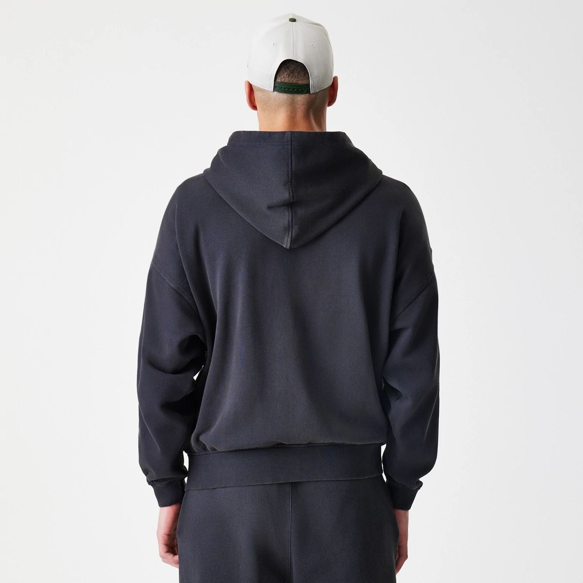 The Male model is wearing  New Era Washed Black Oversized Full Zip Hoodie  2