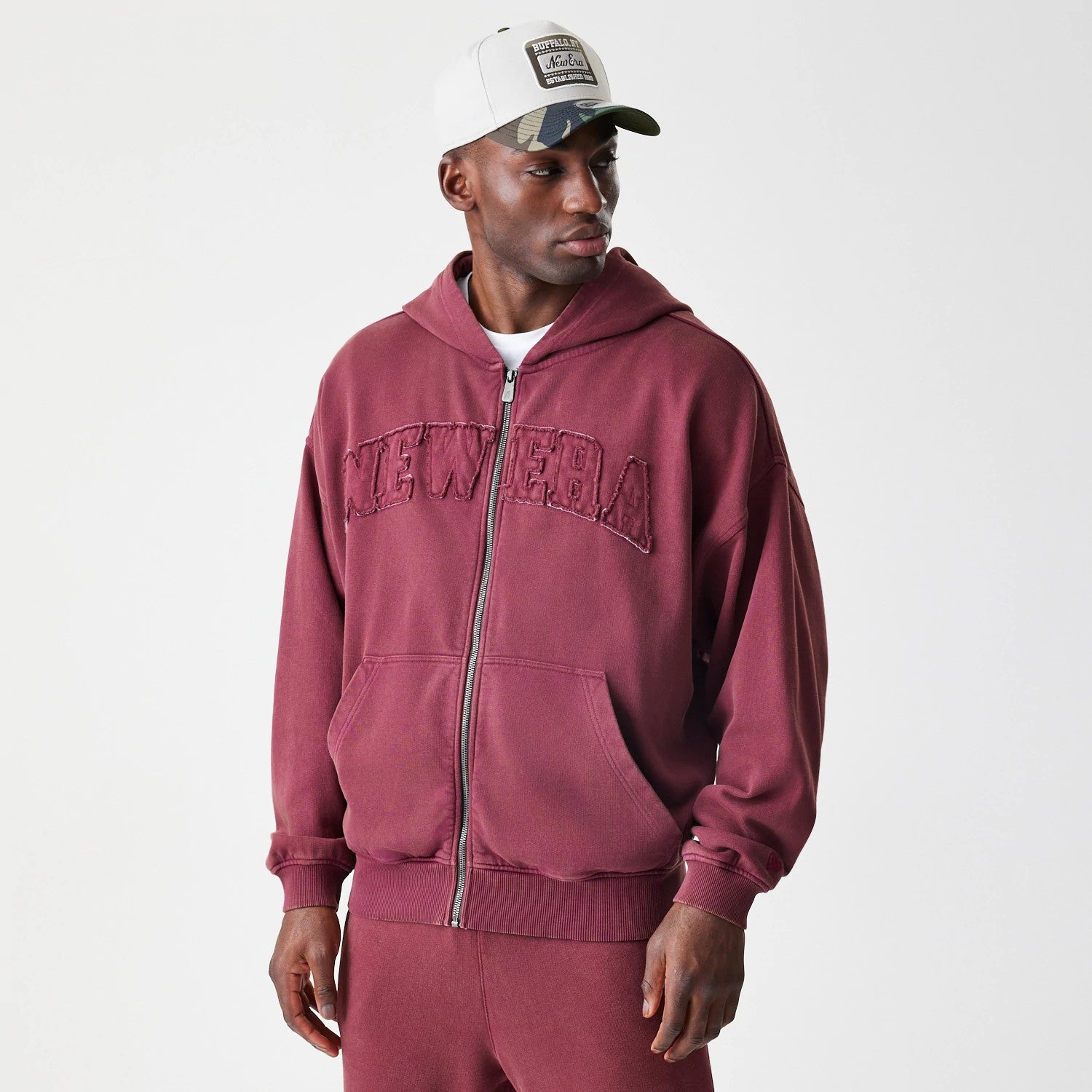 The Male model is wearing  New Era Washed Dark Red Oversized Full Zip Hoodie 3