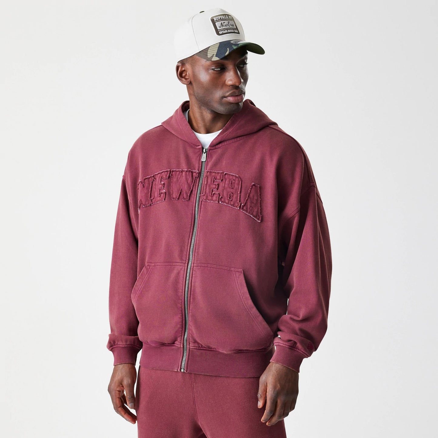 The Male model is wearing  New Era Washed Dark Red Oversized Full Zip Hoodie 3