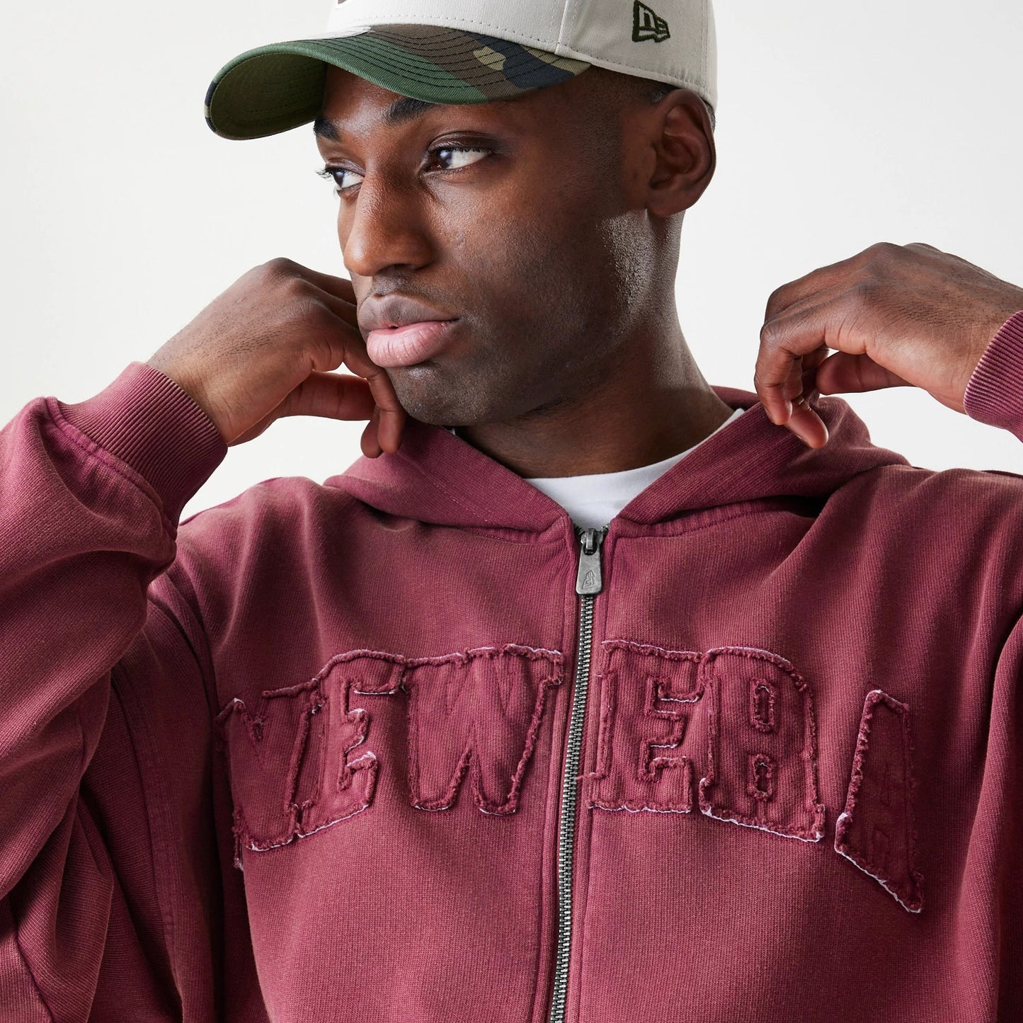 The Male model is wearing  New Era Washed Dark Red Oversized Full Zip Hoodie 5