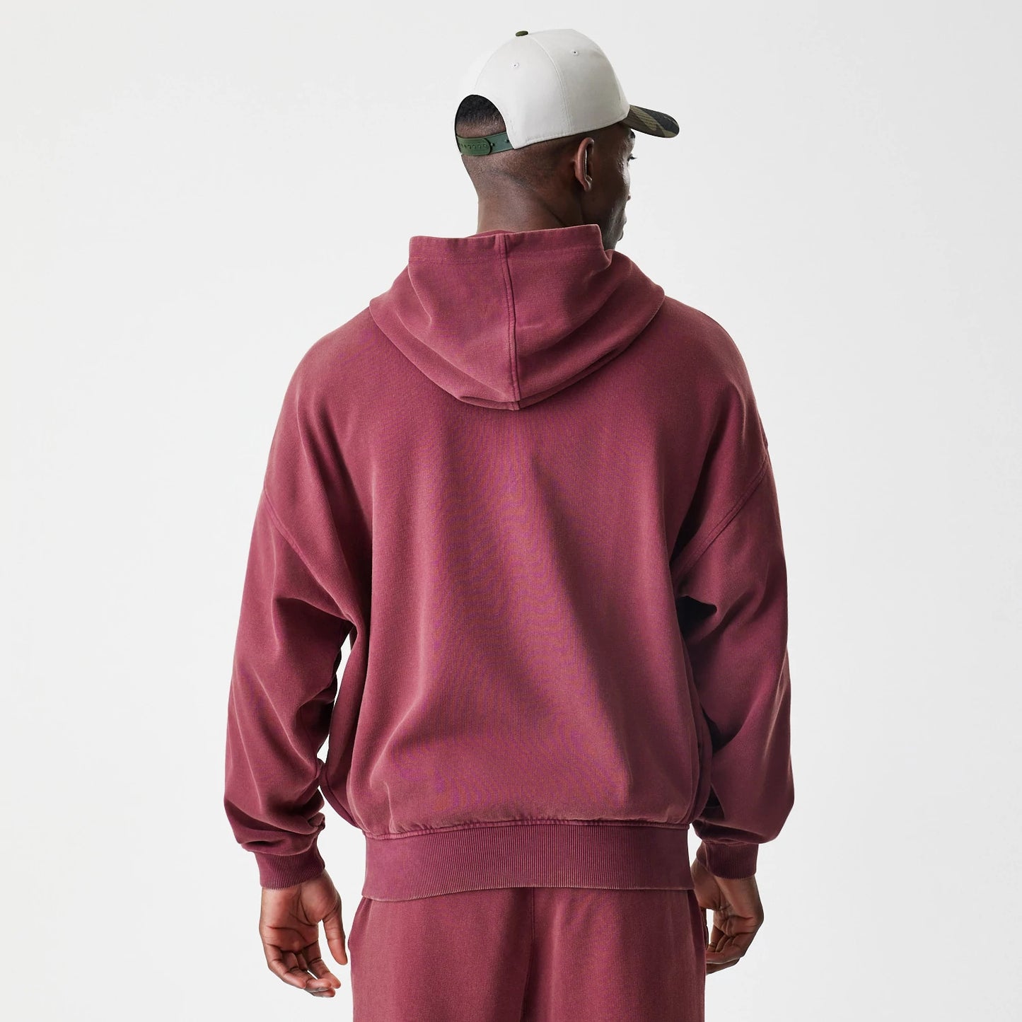 The Male model is wearing  New Era Washed Dark Red Oversized Full Zip Hoodie 2