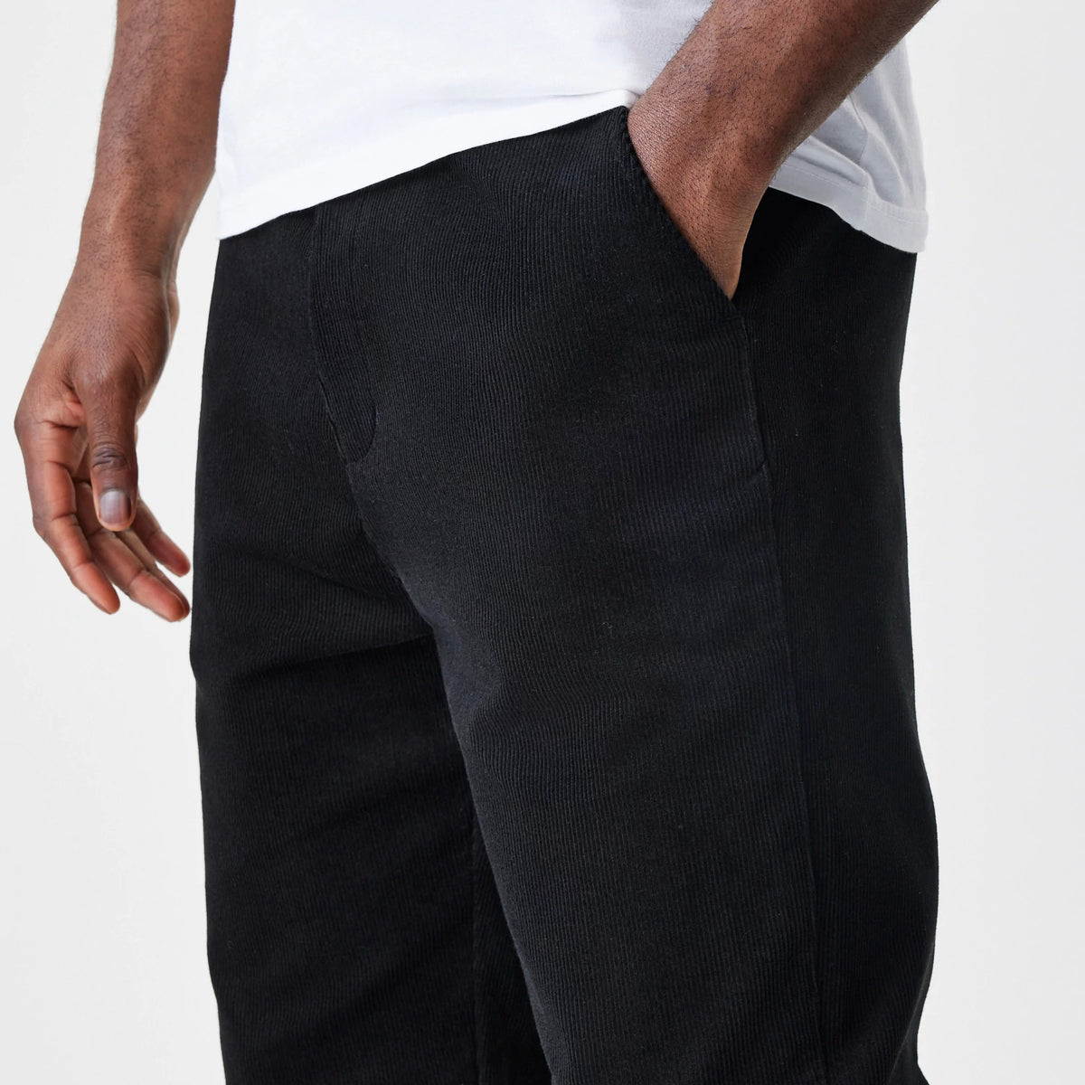 The Male model is wearing  New Era Cord Black Straight Leg Chinos 5