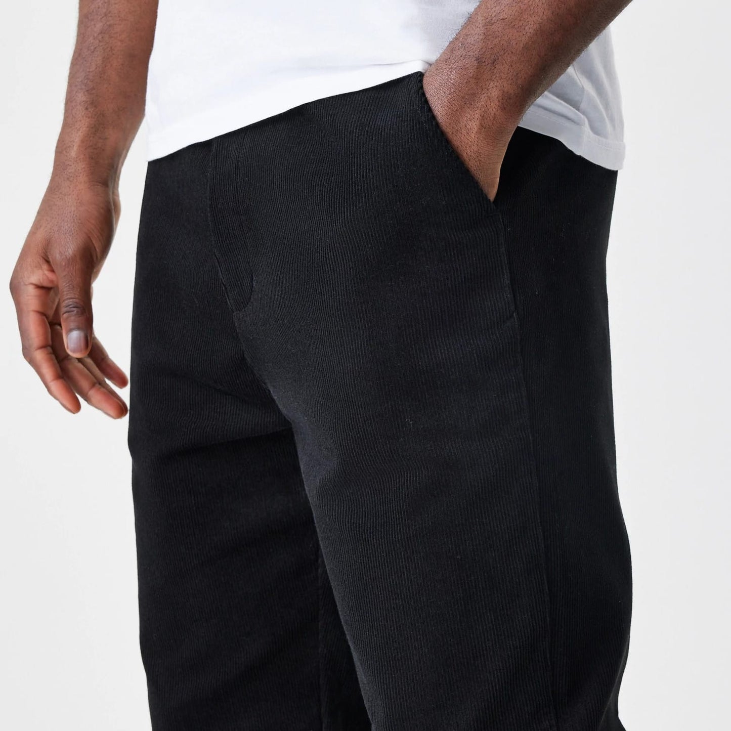 The Male model is wearing  New Era Cord Black Straight Leg Chinos 5