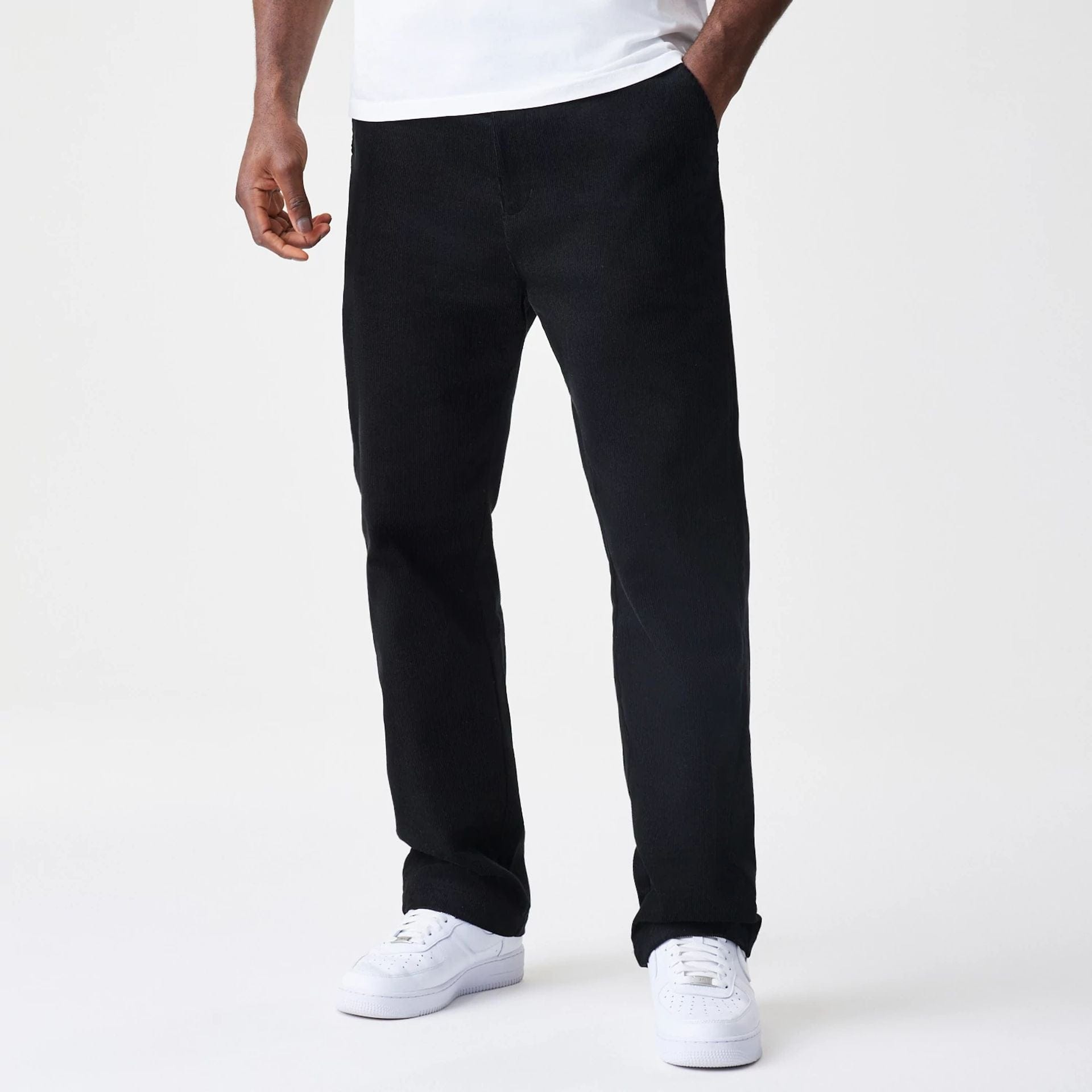 The Male model is wearing  New Era Cord Black Straight Leg Chinos 1
