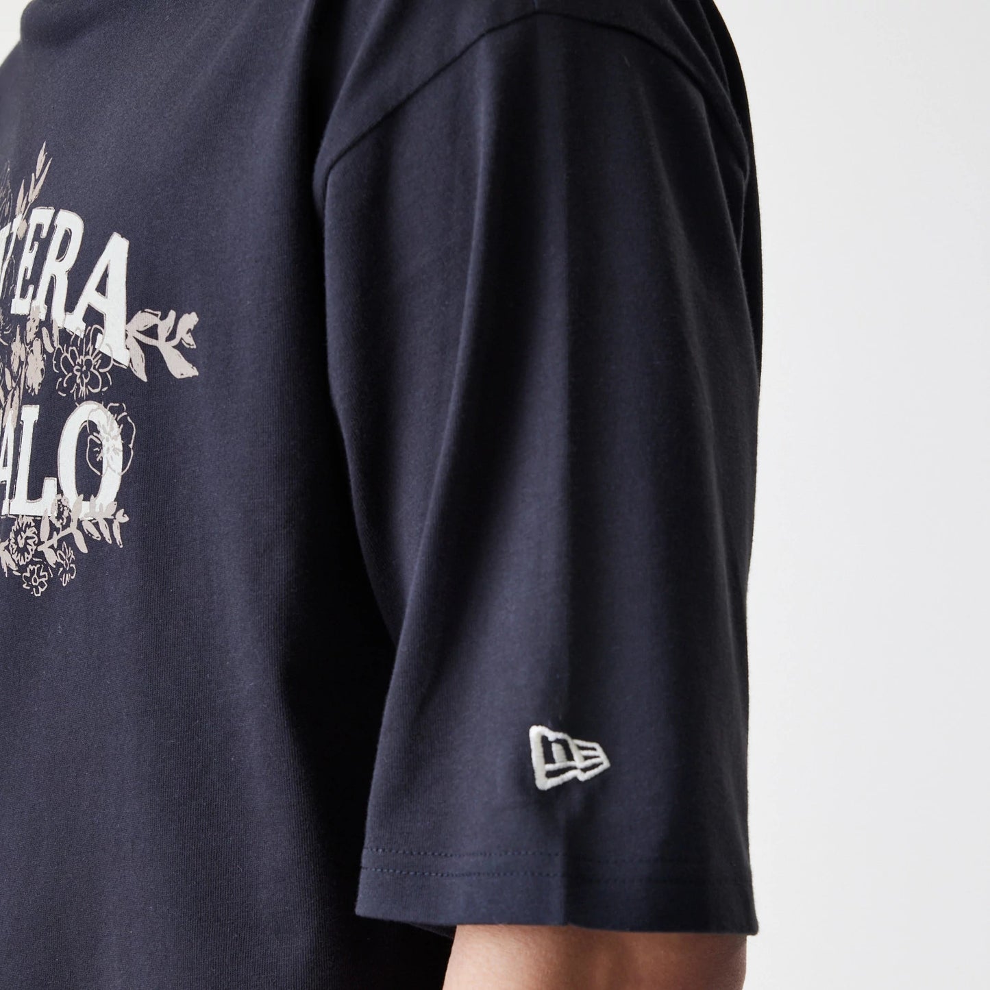 The Male model is wearing  New Era Floral Black Oversized T-Shirt 5