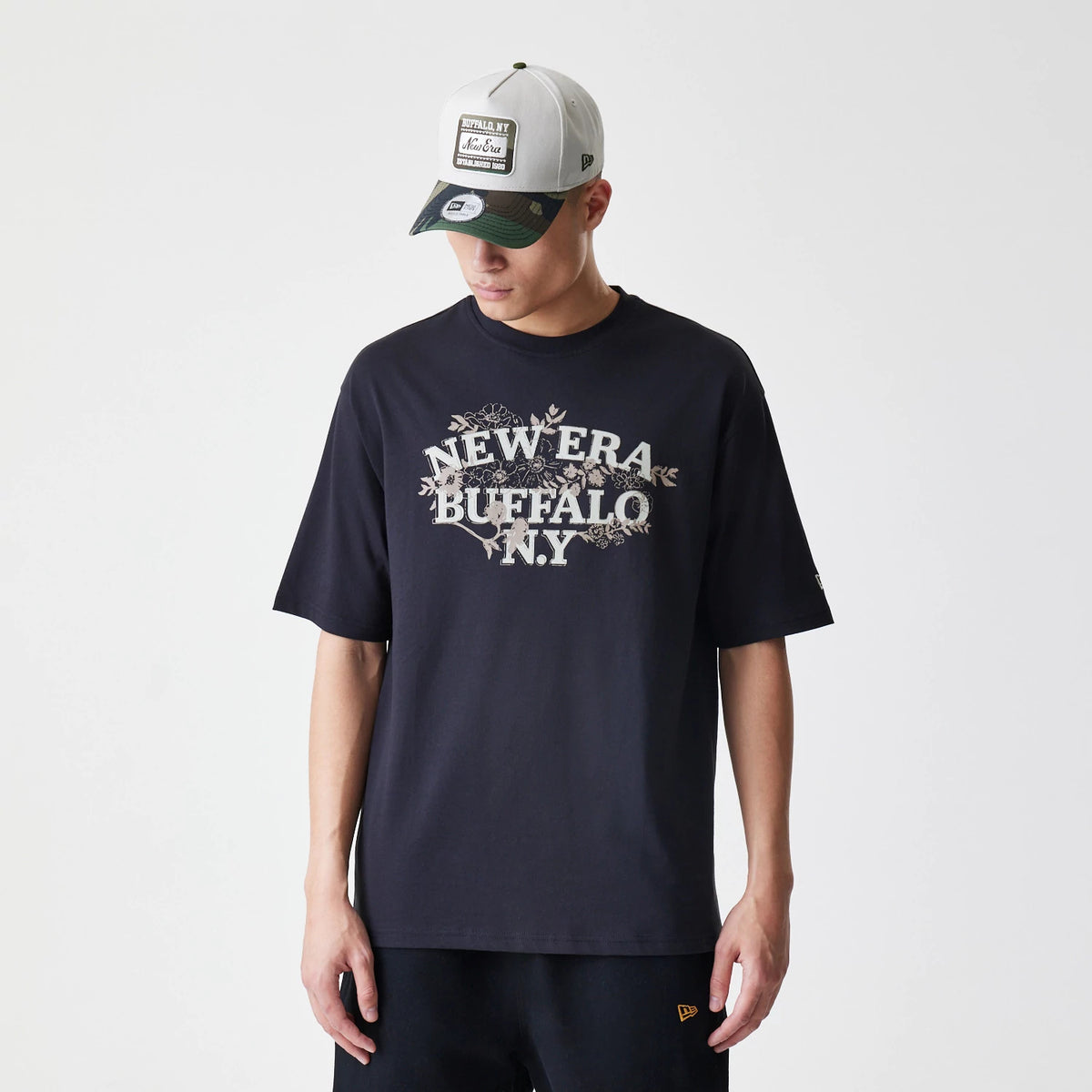 The Male model is wearing  New Era Floral Black Oversized T-Shirt 1