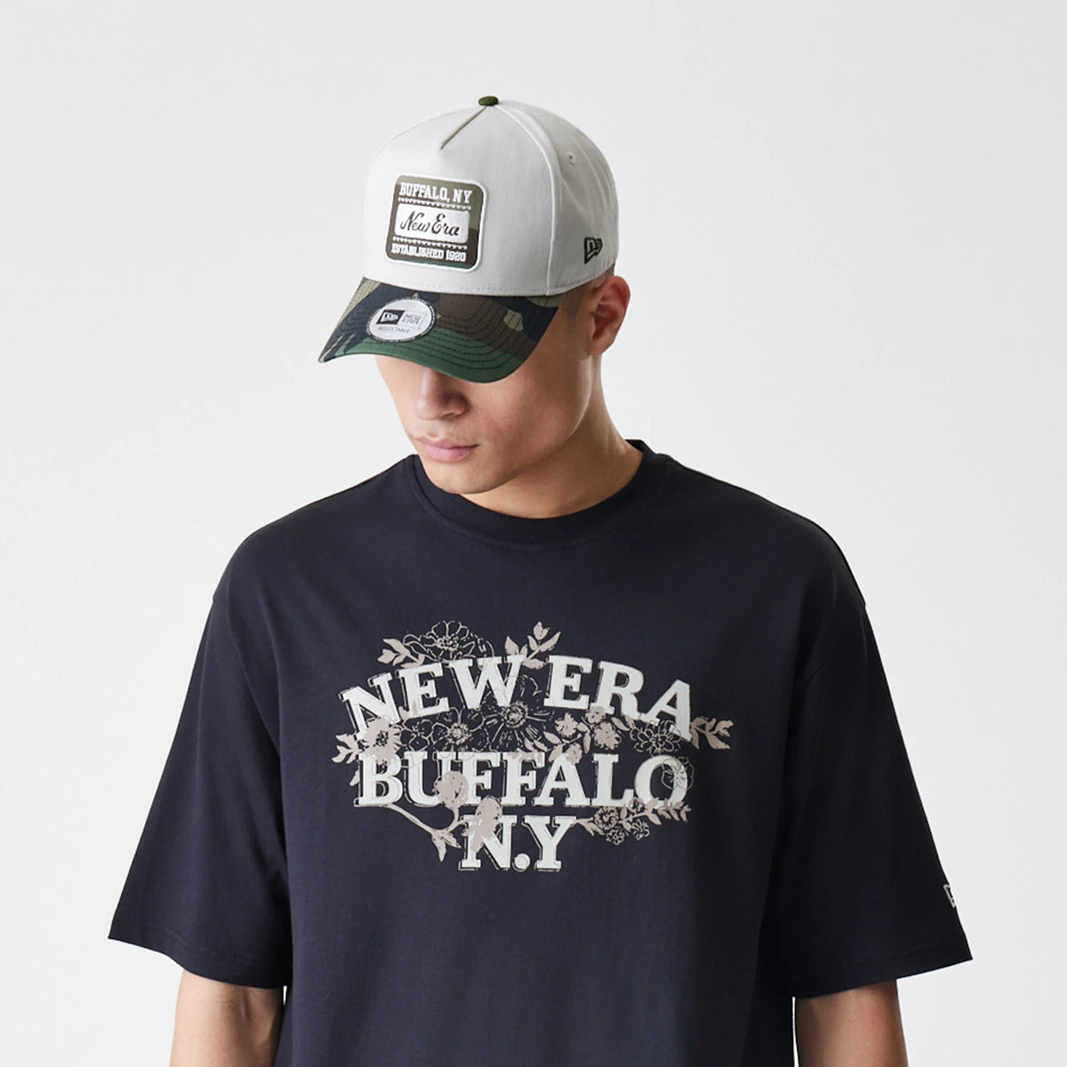 The Male model is wearing  New Era Floral Black Oversized T-Shirt 6