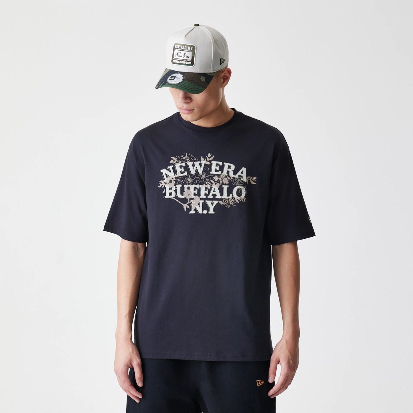 The Male model is wearing  New Era Floral Black Oversized T-Shirt  1
