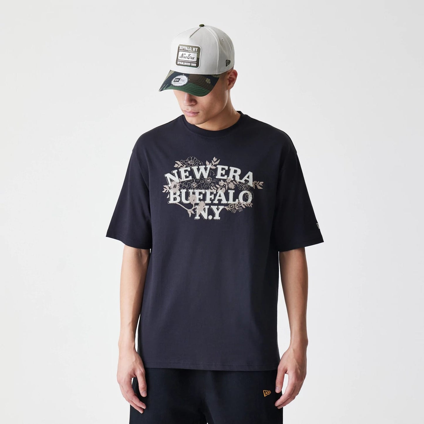 The Male model is wearing  New Era Floral Black Oversized T-Shirt 1