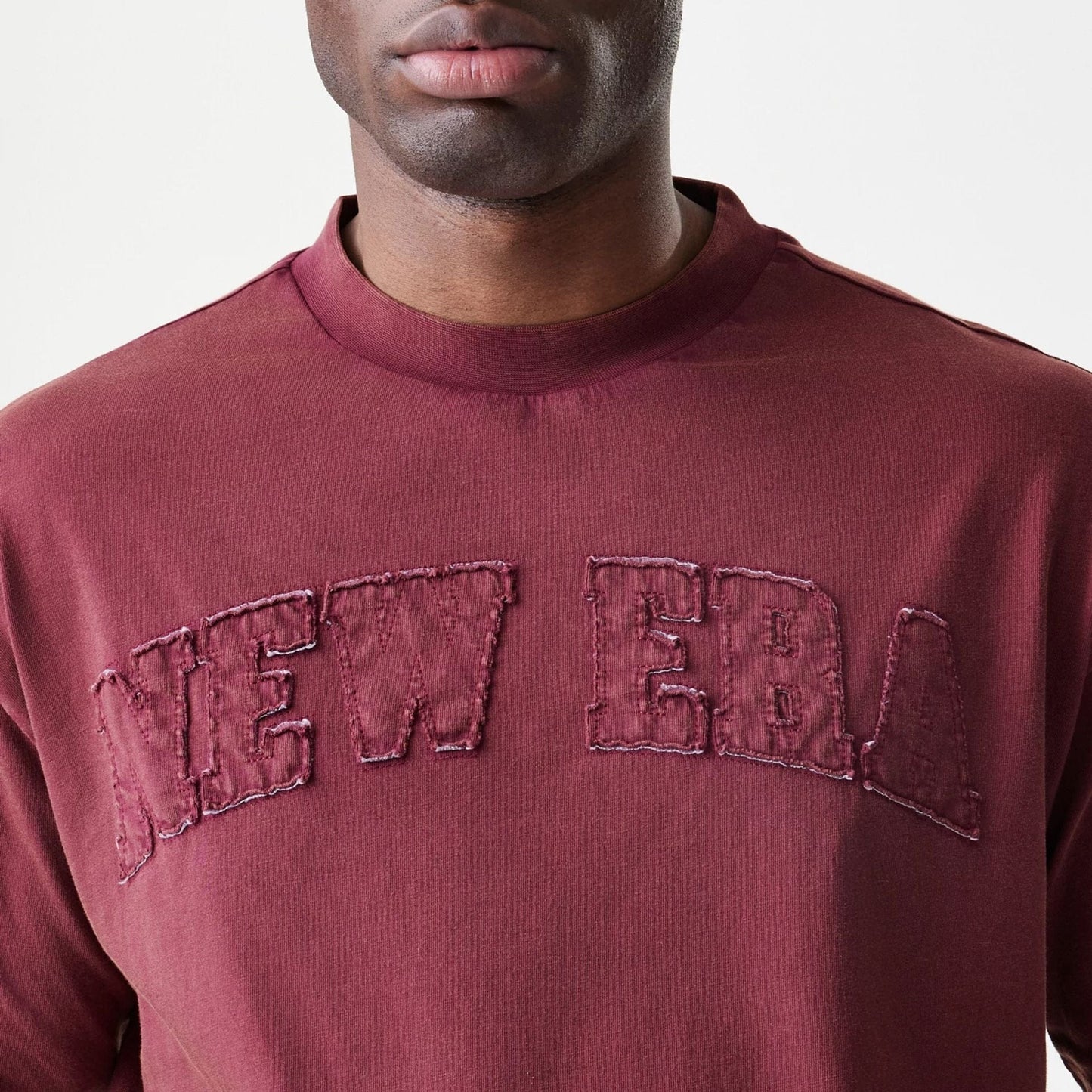 The Male model is wearing  New Era Washed Dark Red Oversized T-Shirt  5