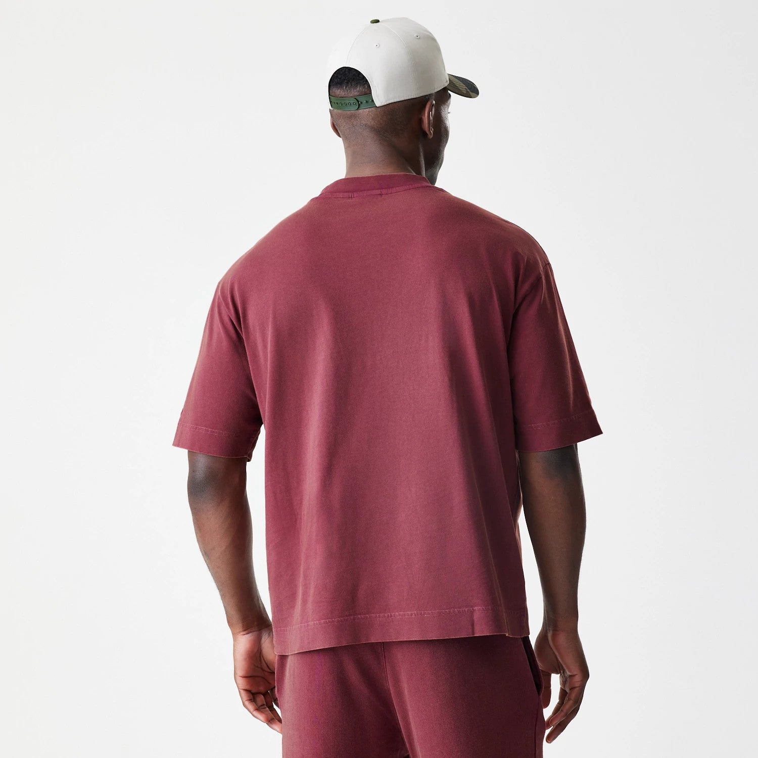 The Male model is wearing  New Era Washed Dark Red Oversized T-Shirt 2