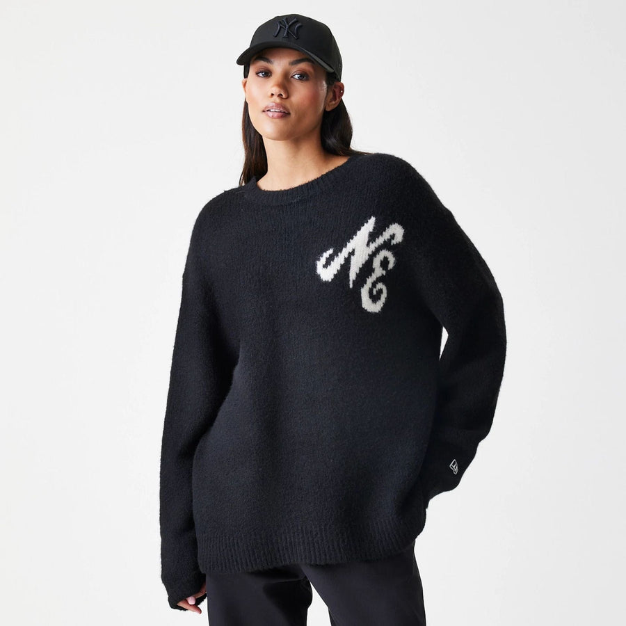 The Male model is wearing New Era Knit Black Knitted Sweater 4