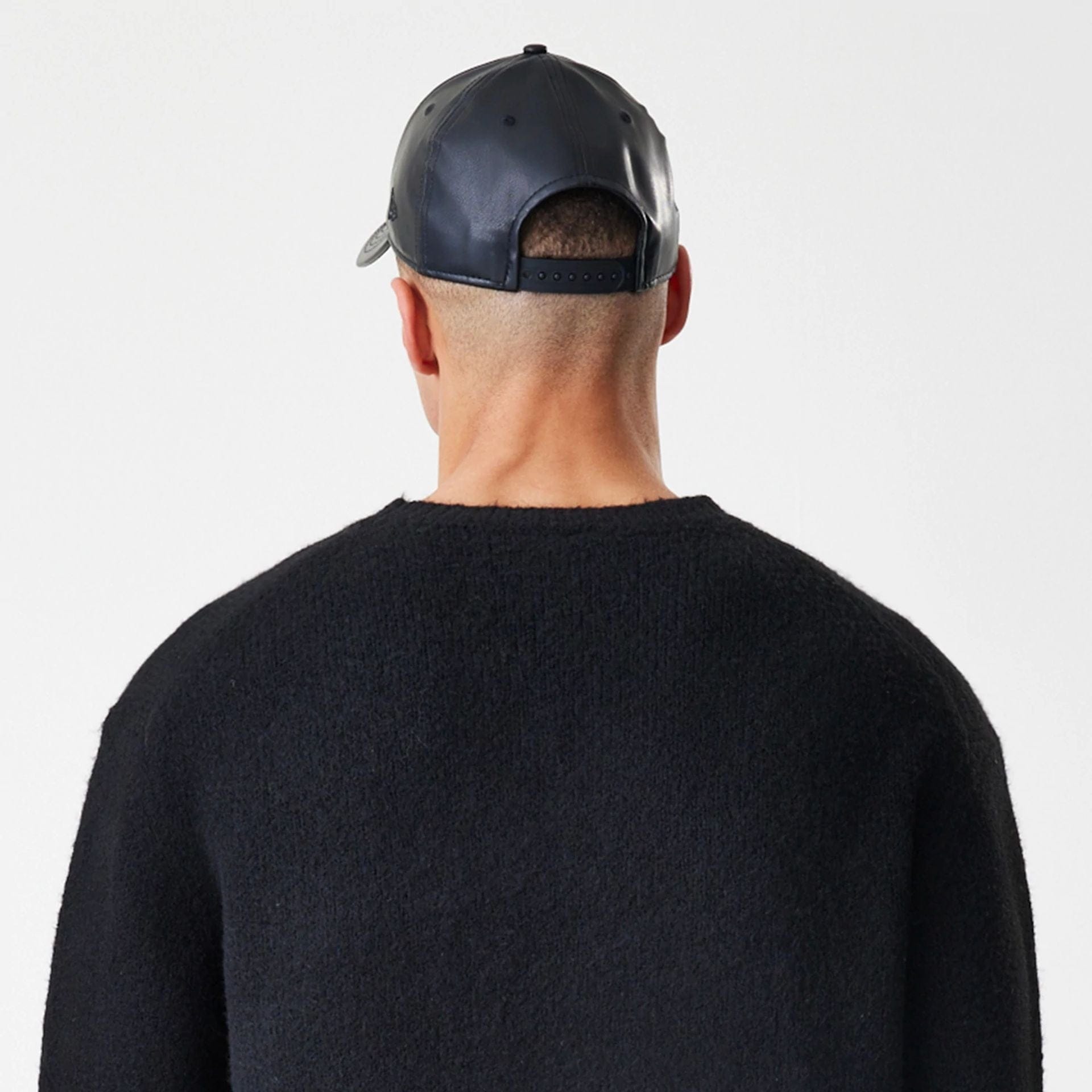 The Male model is wearing New Era Knit Black Knitted Sweater 8
